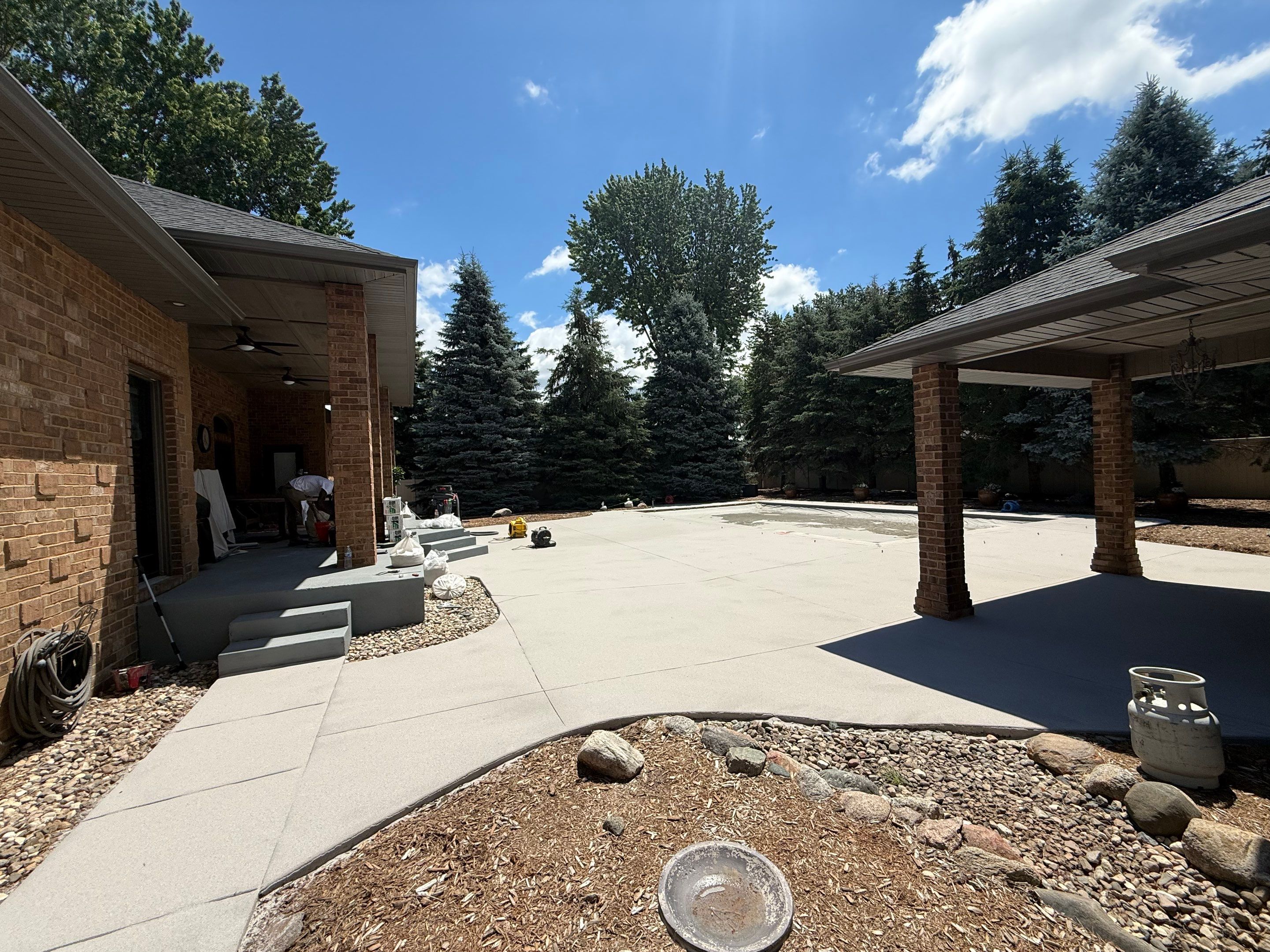 Decorative Concrete Pool Deck and Patio Resurfacing in Sioux Falls by Select Painting, Coatings & Garage Cabinets