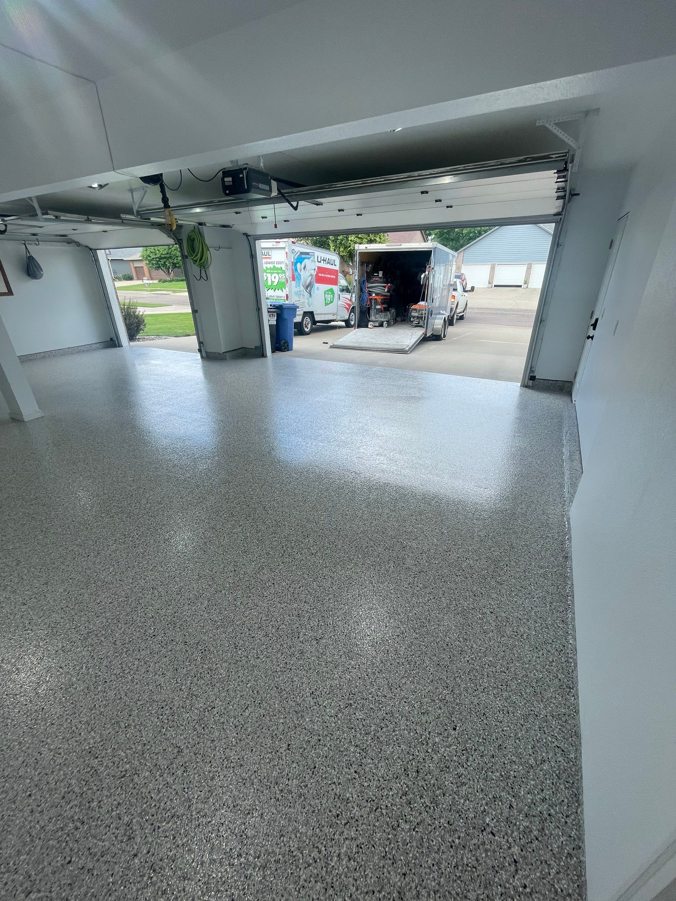 Multi-Car Garage Concrete Coating with Coyote Flake Finish in Sioux Falls by Select Painting, Coatings & Garage Cabinets