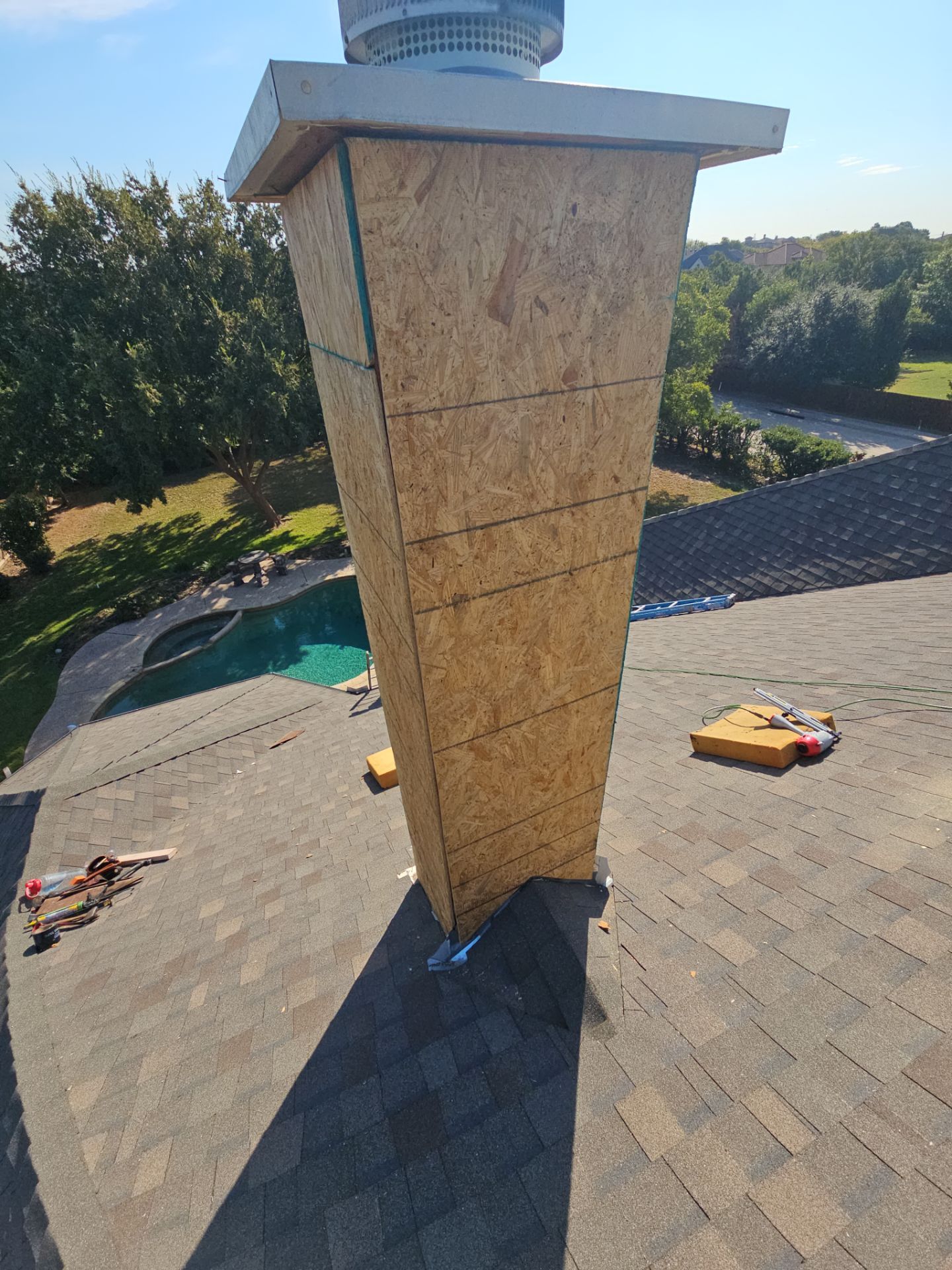chimney repair using lap engineered treated composite siding. by road roofing llc