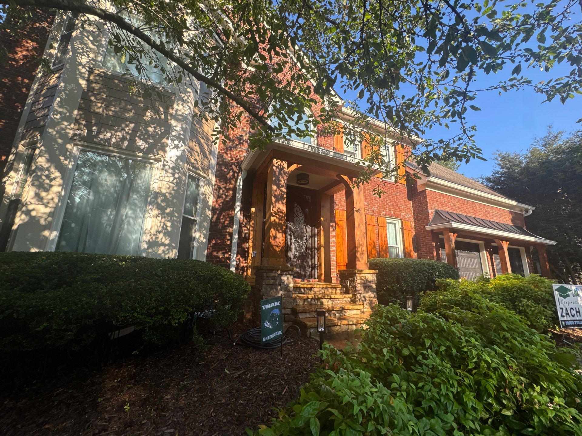 Exterior Modernization Featuring New Siding and Custom Wood Portico by Swift Home Renovations