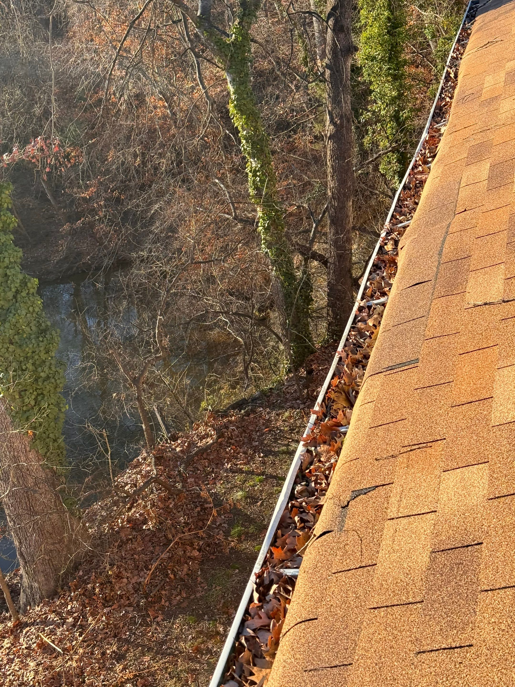 Commercial gutter cleaning Fredericksburg, VA before photo with filled gutters