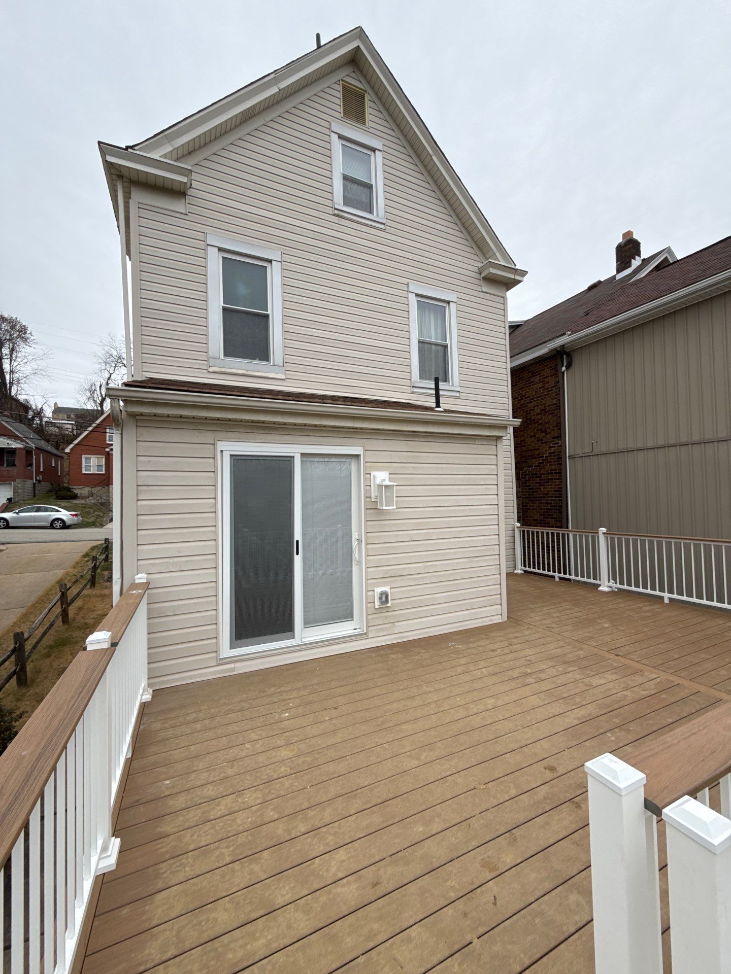 Deck and door by Cousins Roofing Siding & Decks