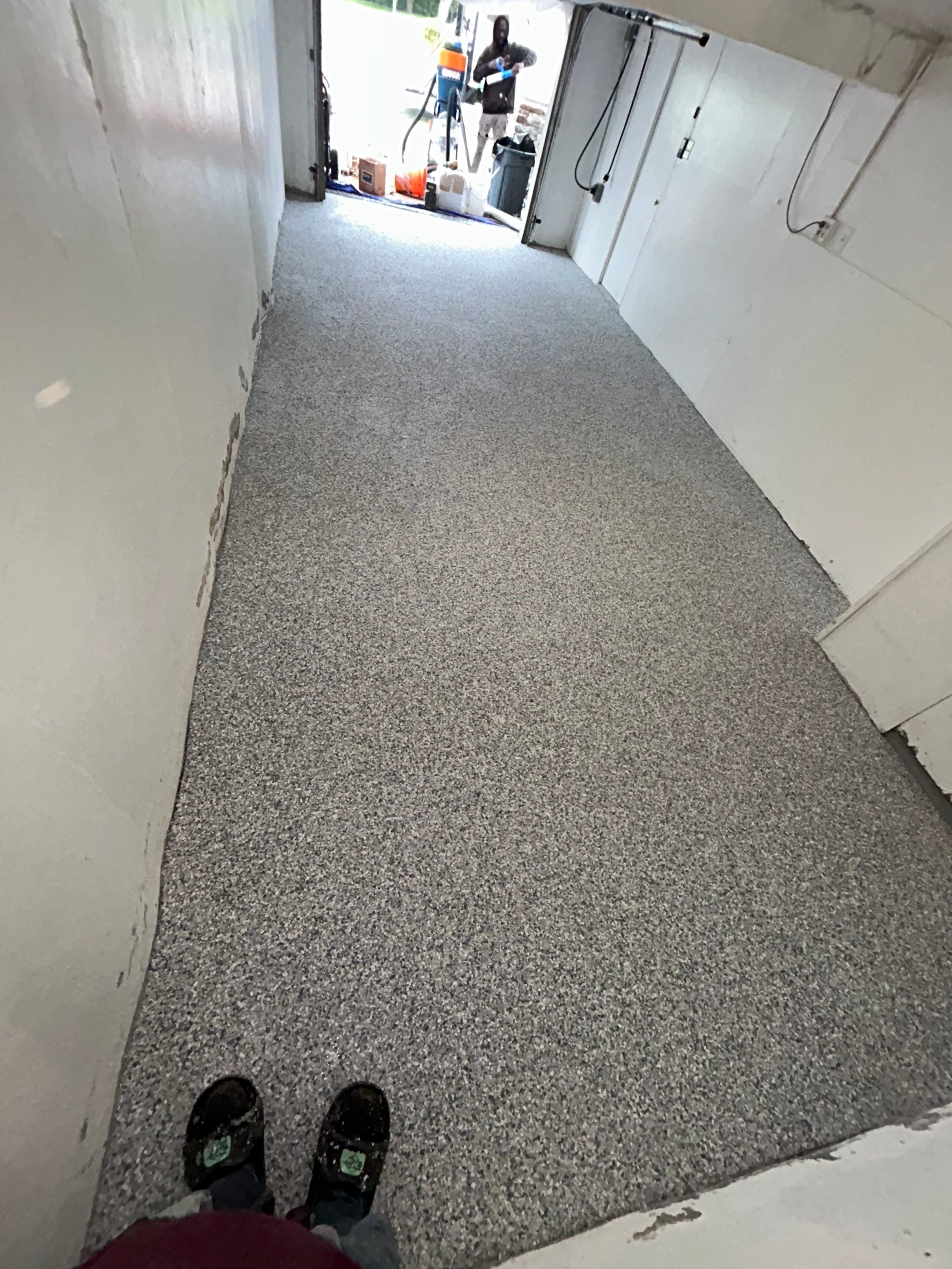 Garage Concrete Floor Coating Transformation  by DiGiorgi Roofing and Siding Inc
