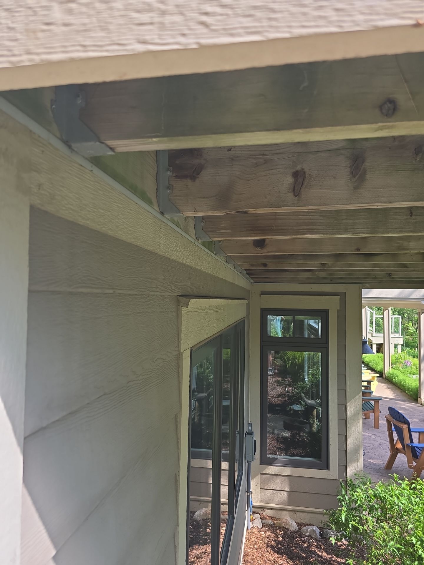Traverse City Underdecking Installation with Integrated Seamless Gutter System by Rainbow Seamless Systems