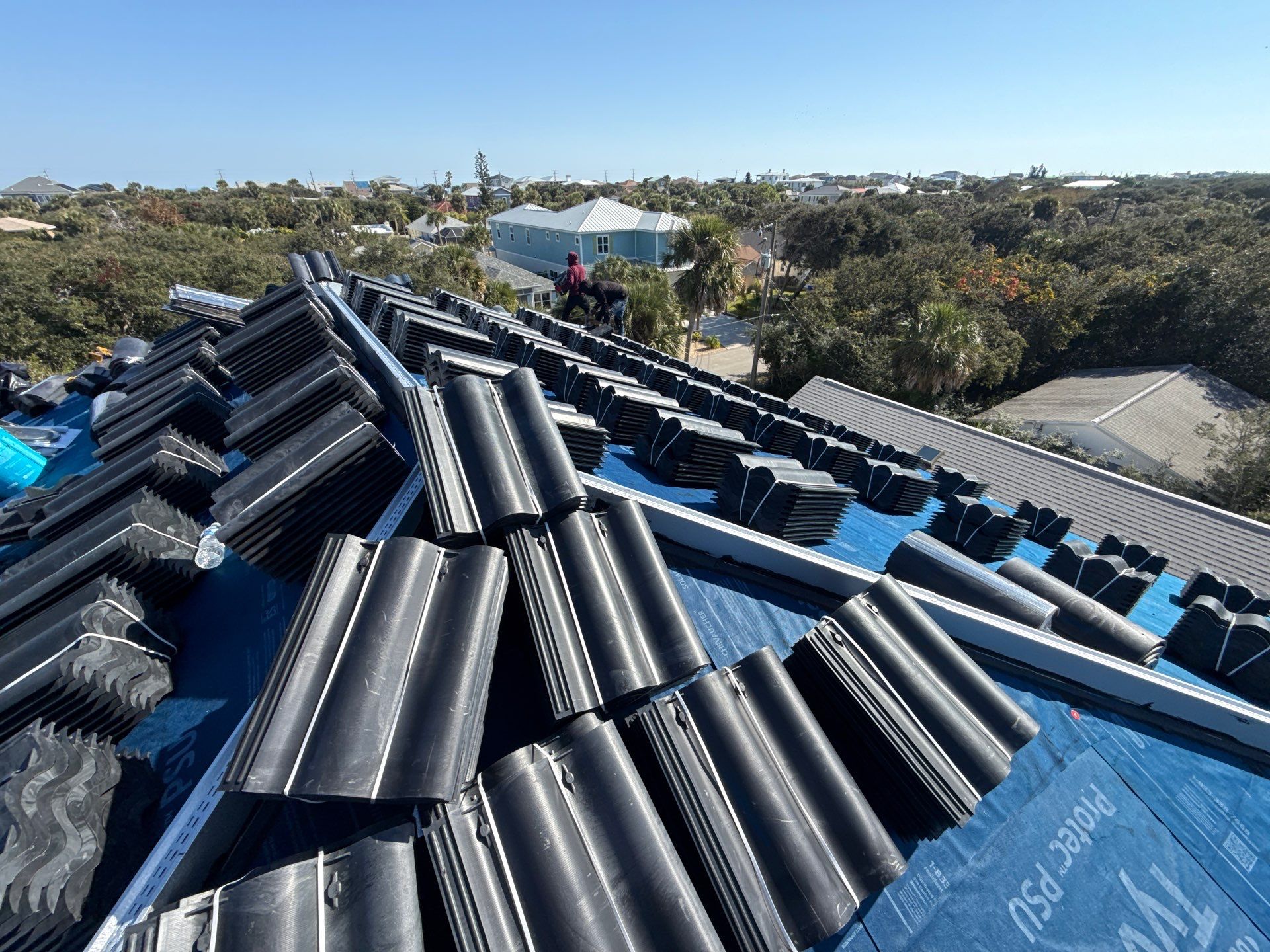 Flagler Beach Residential Tile Roof Replacement with Dark Barrel Tiles by Fortified Roofing Solutions Corp.