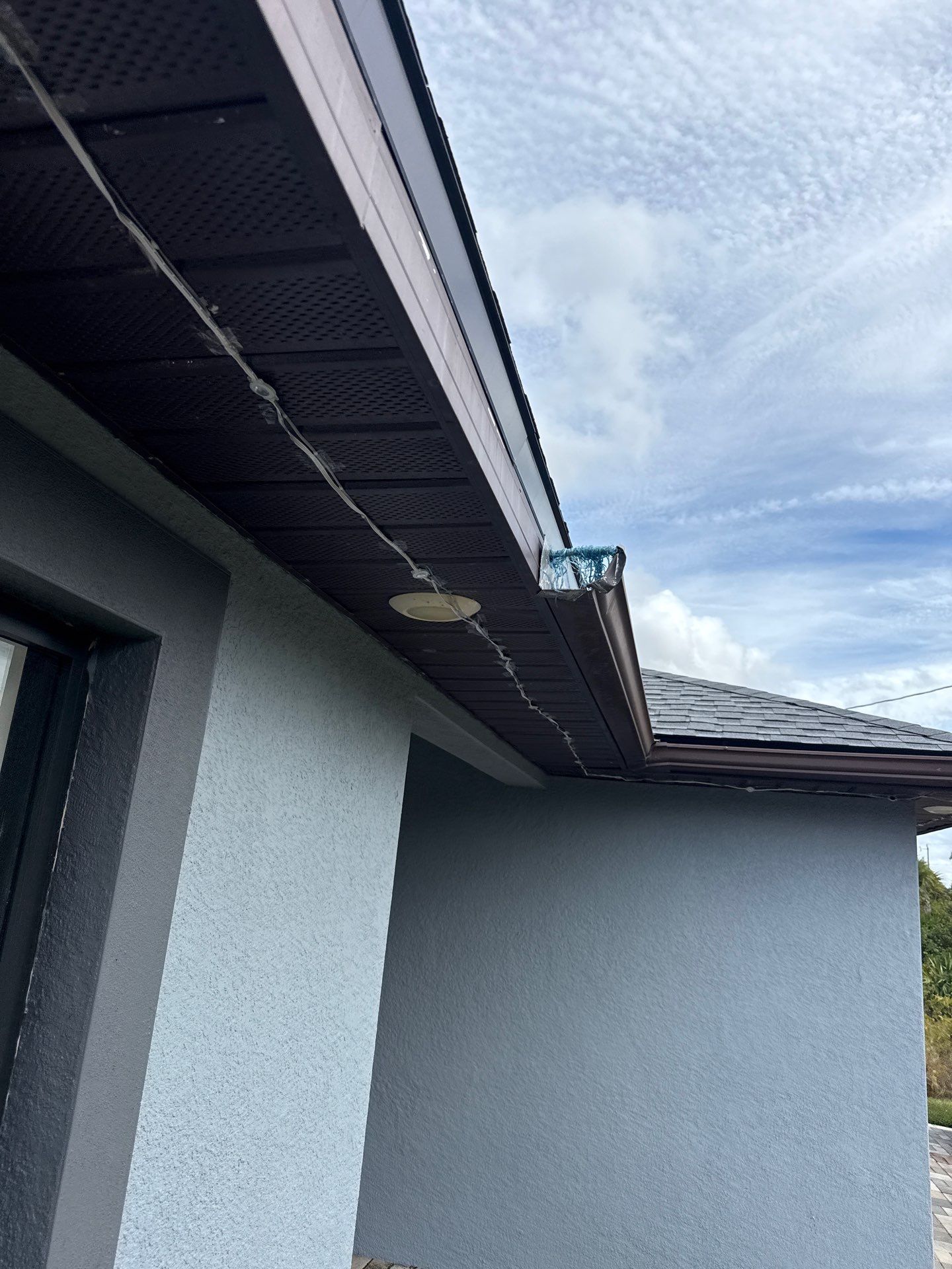 Black Seamless Gutters & Soffit/Fascia in Lehigh Acres FL by Gutter Professors
