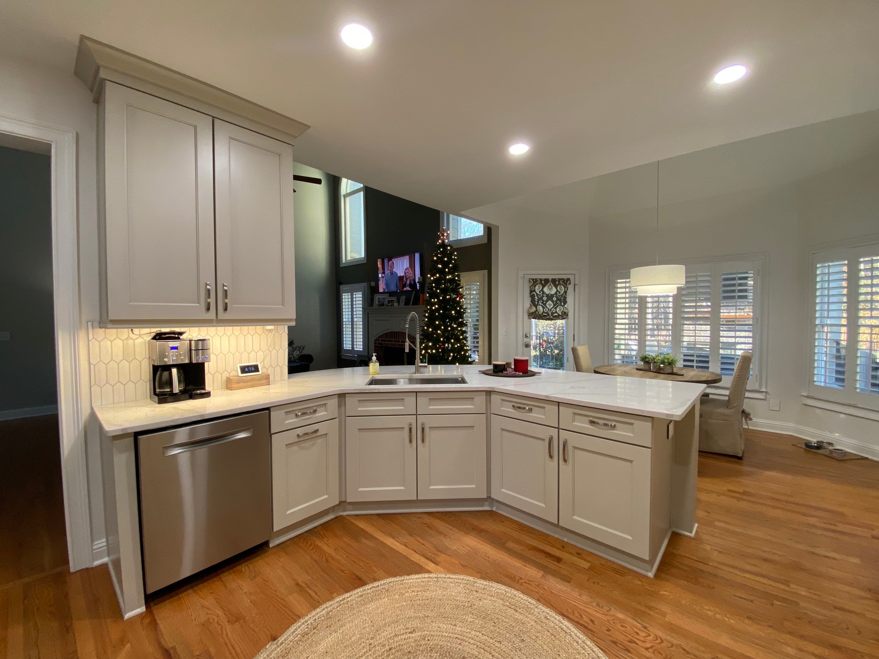 Modern Kitchen Remodeling with Quartz Island and Custom Vent Hood in Woodstock by Swift Home Renovations