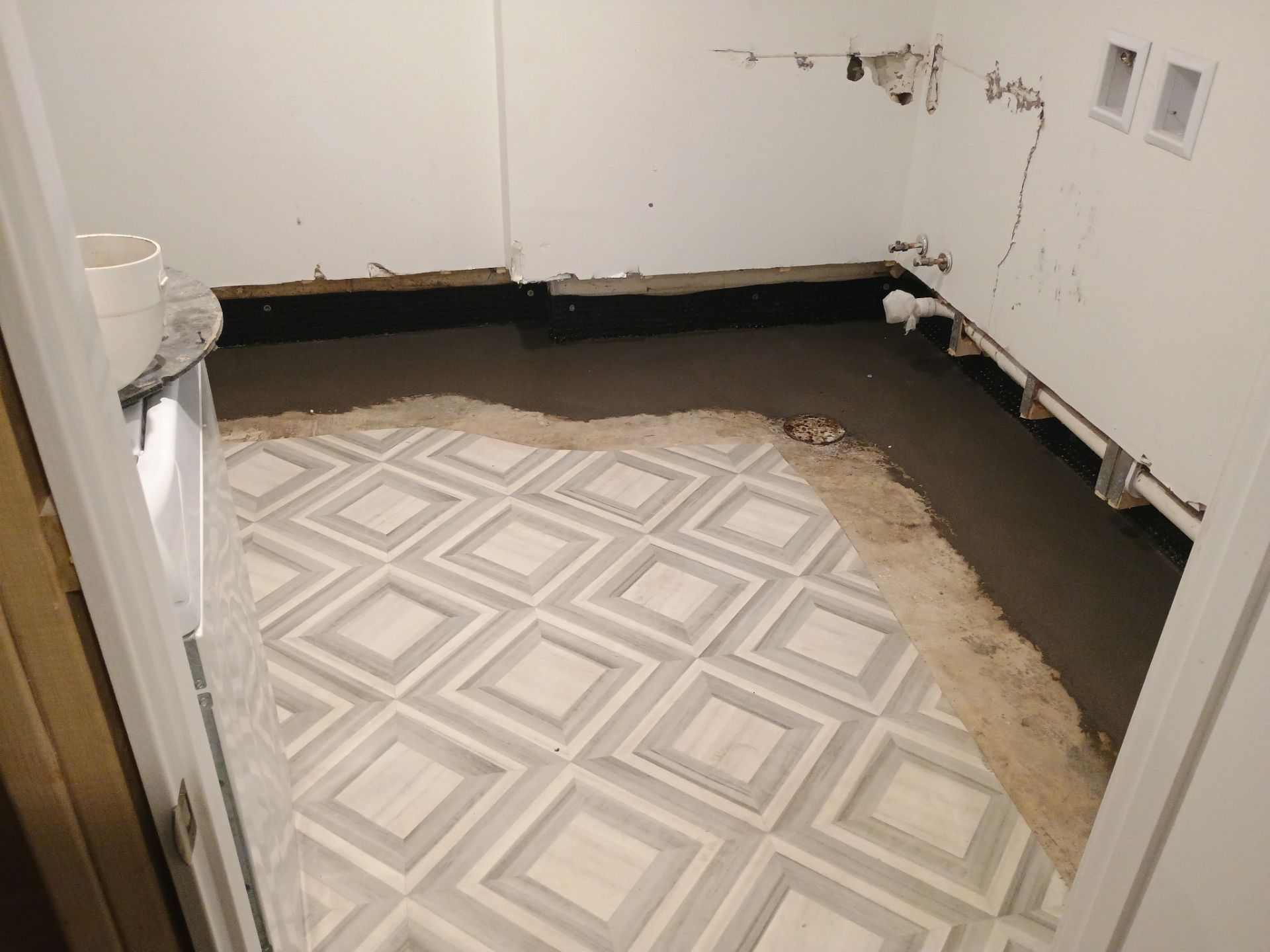 Interior Drain Tile & Buried Discharge in St. Anthony, MN by Waterproofing Northeast