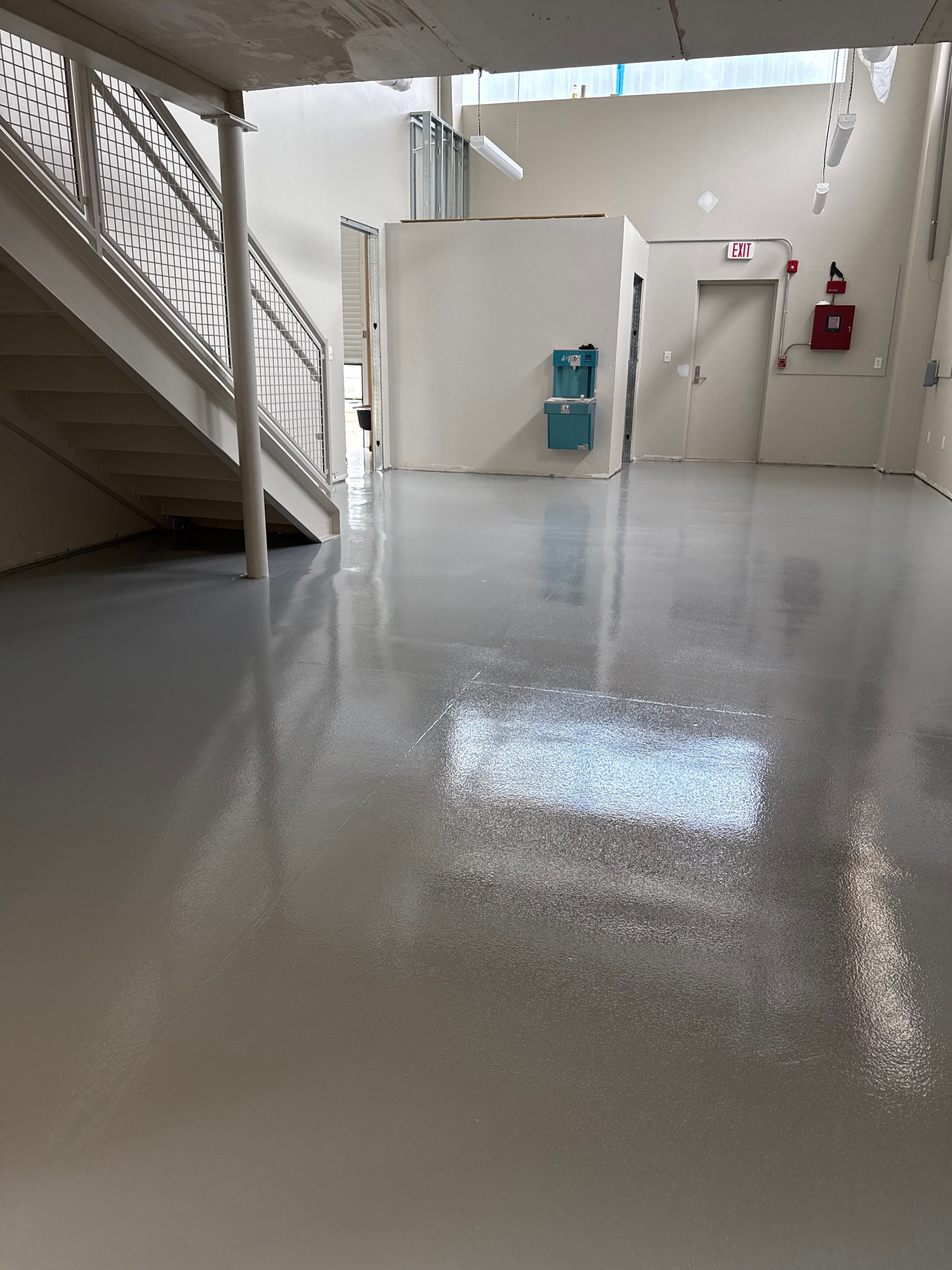 Industrial Epoxy Flooring for Sandhill Crane Workshop in Gautier by Cornerstone Hard Surface Restoration 