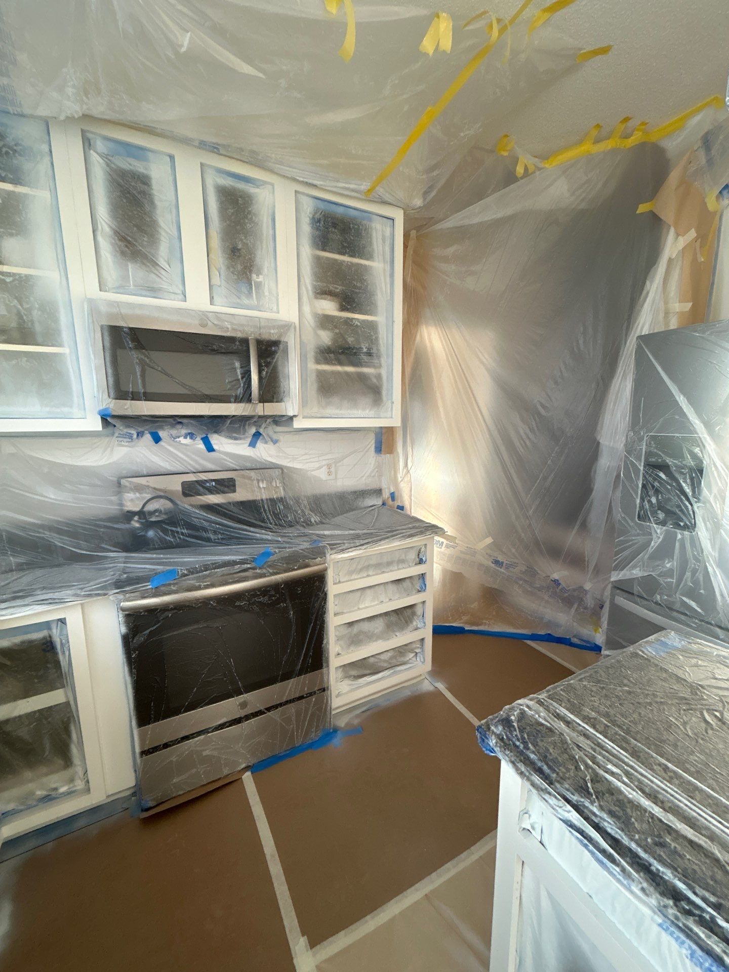 Cabinet painting by GonzalezPainters & Contractors Inc 