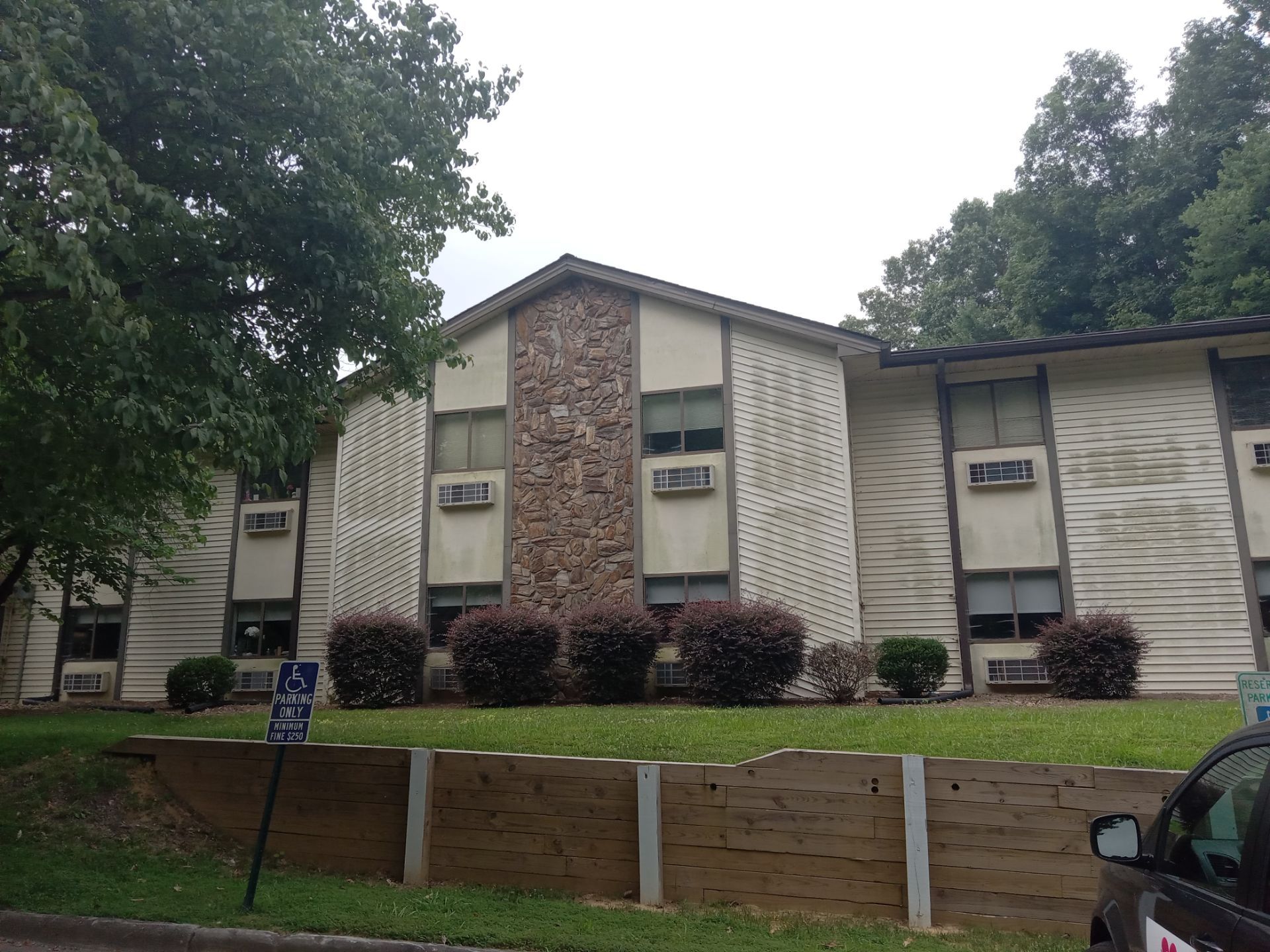 pressure washing building exteriors to remove dirt and mildew from siding and stonework surfaces