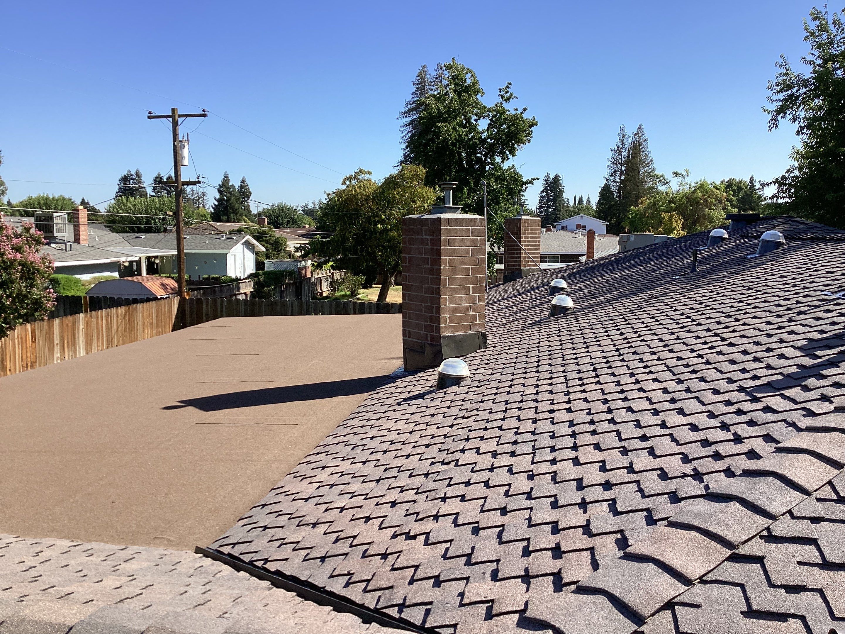 Installation of Certainteed Presidential shingles on residential house by Straight Edge Roofing Inc