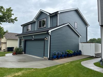James Hardie Siding and Window Replacement with Arctic White Trim