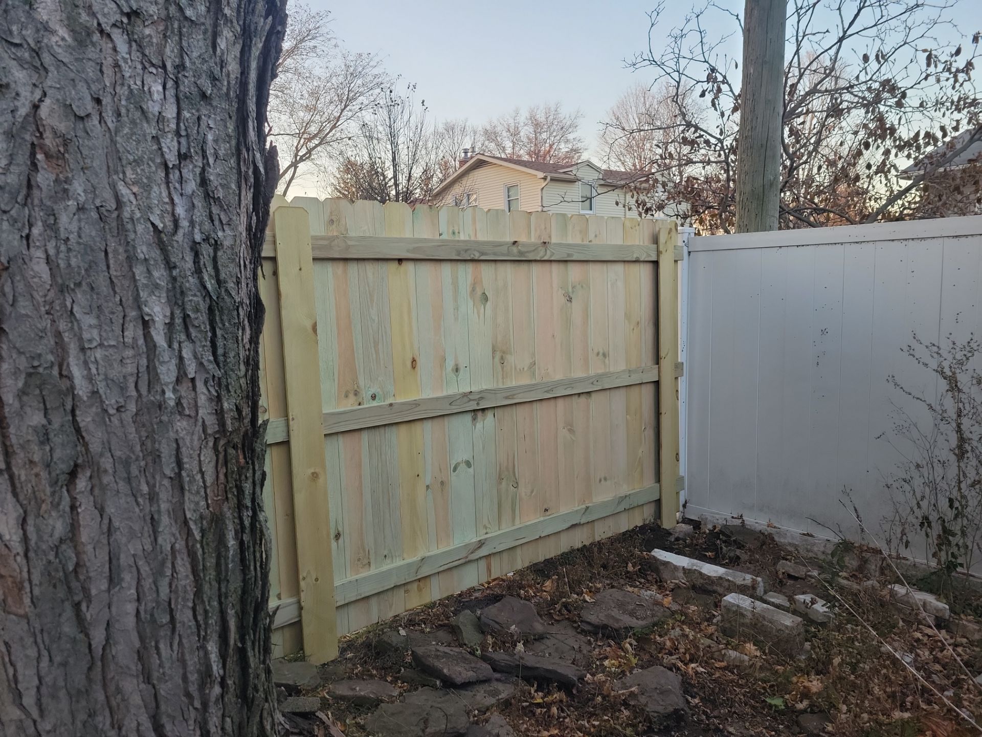 New Pressure-Treated Wood Privacy Fence and Gate in Charles City by Perfect Picket Fence and Stain