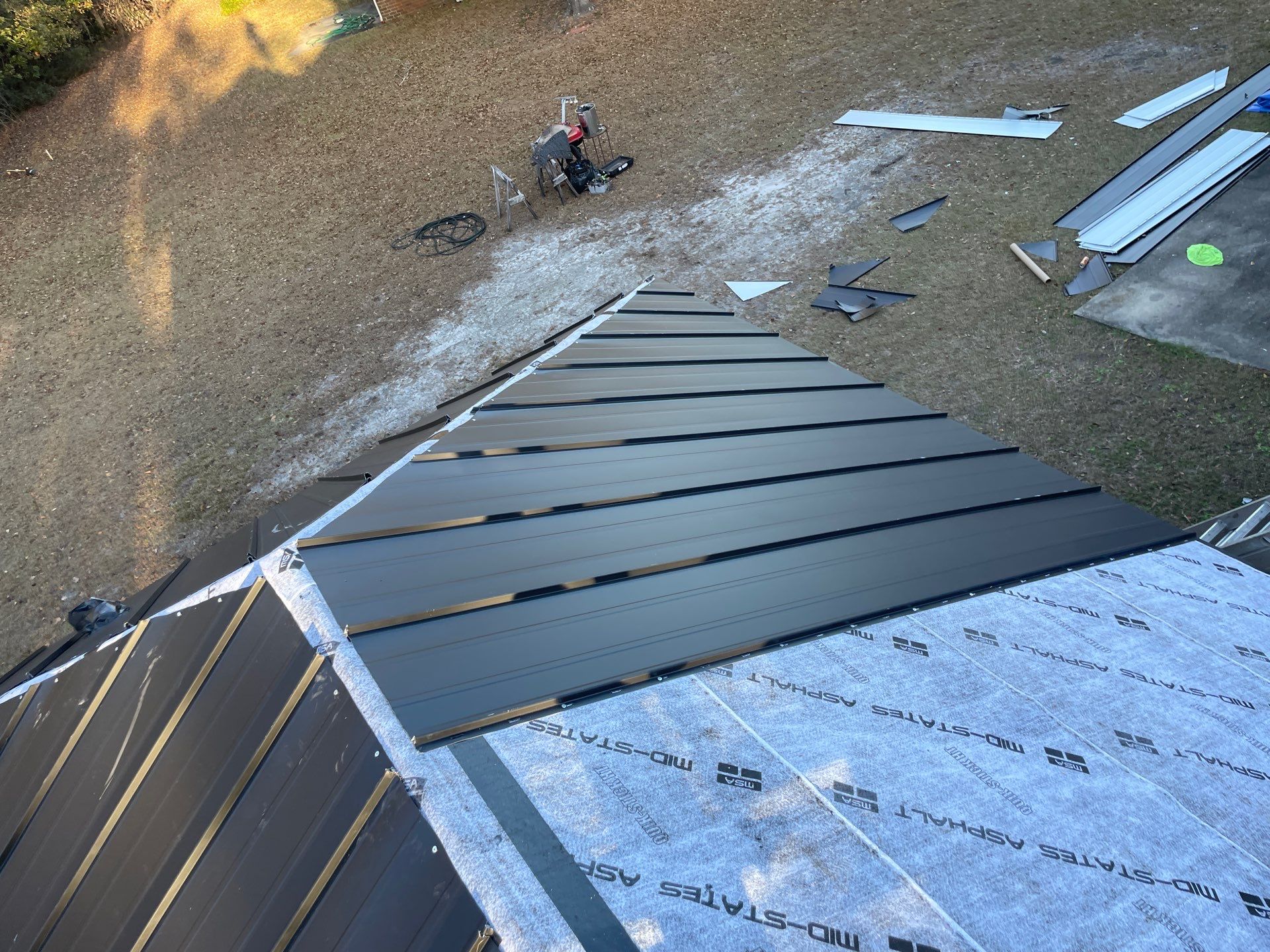Residential Roofing Installation using Benton 26Ga 1inc Snapcock Metal Roof KYNAR Matte Black by Talya Roofing