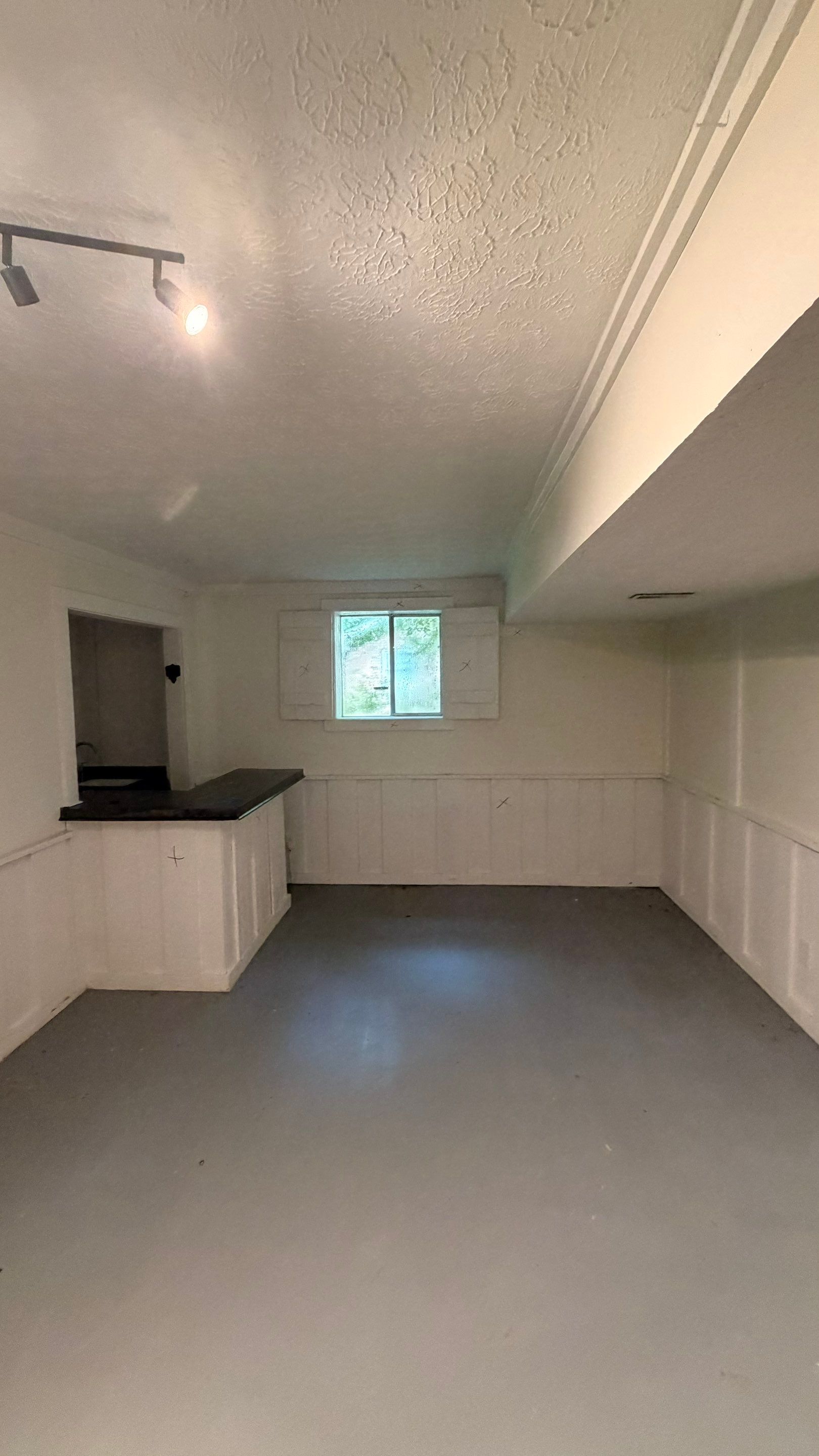 Basement Remodeling with Wood-Look Flooring and Custom Wainscoting in Dunwoody by Swift Home Renovations