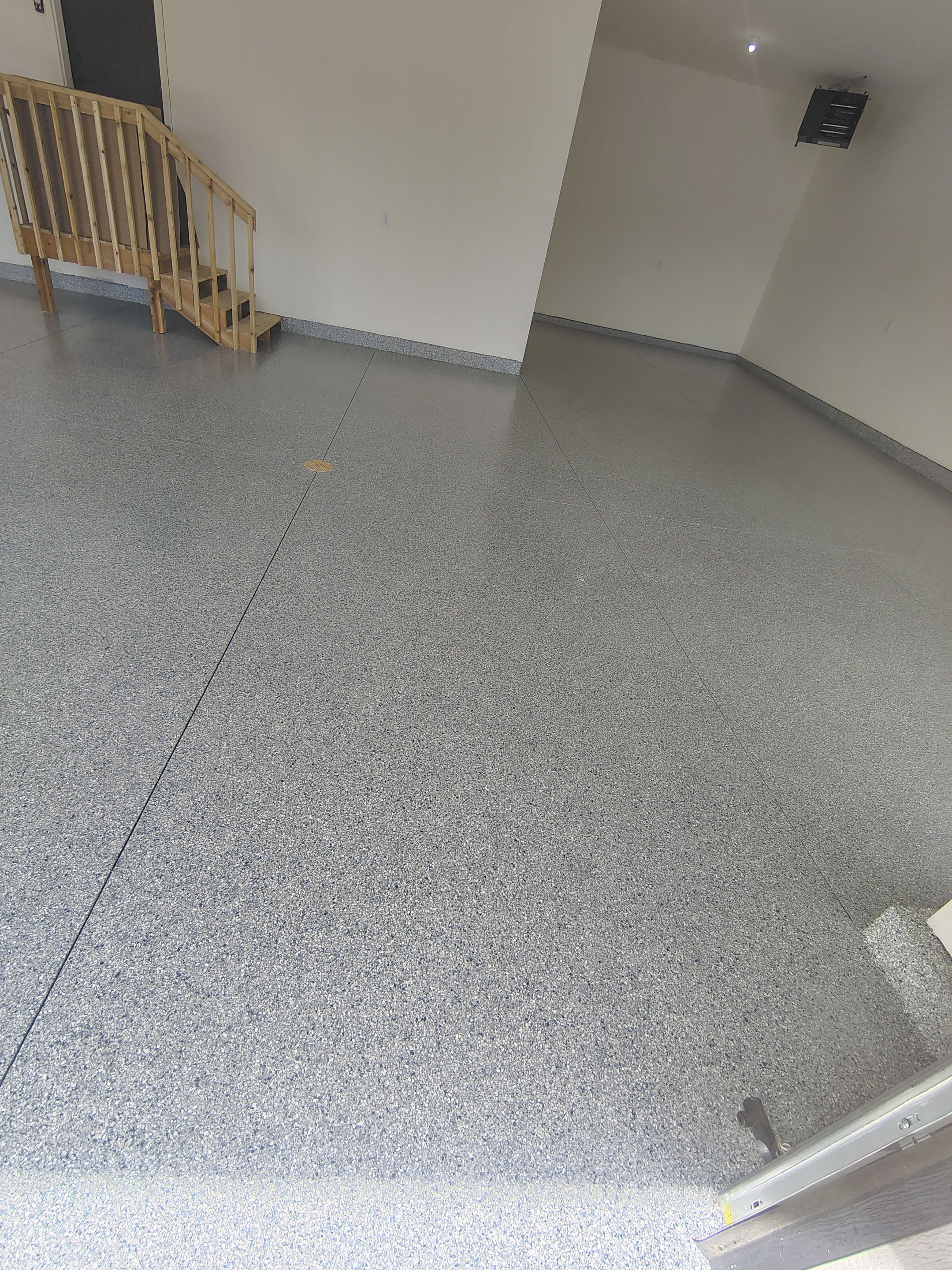 Sioux Falls Garage Floor Transformation with Gray Decorative Flake Coating by Select Painting, Coatings & Garage Cabinets