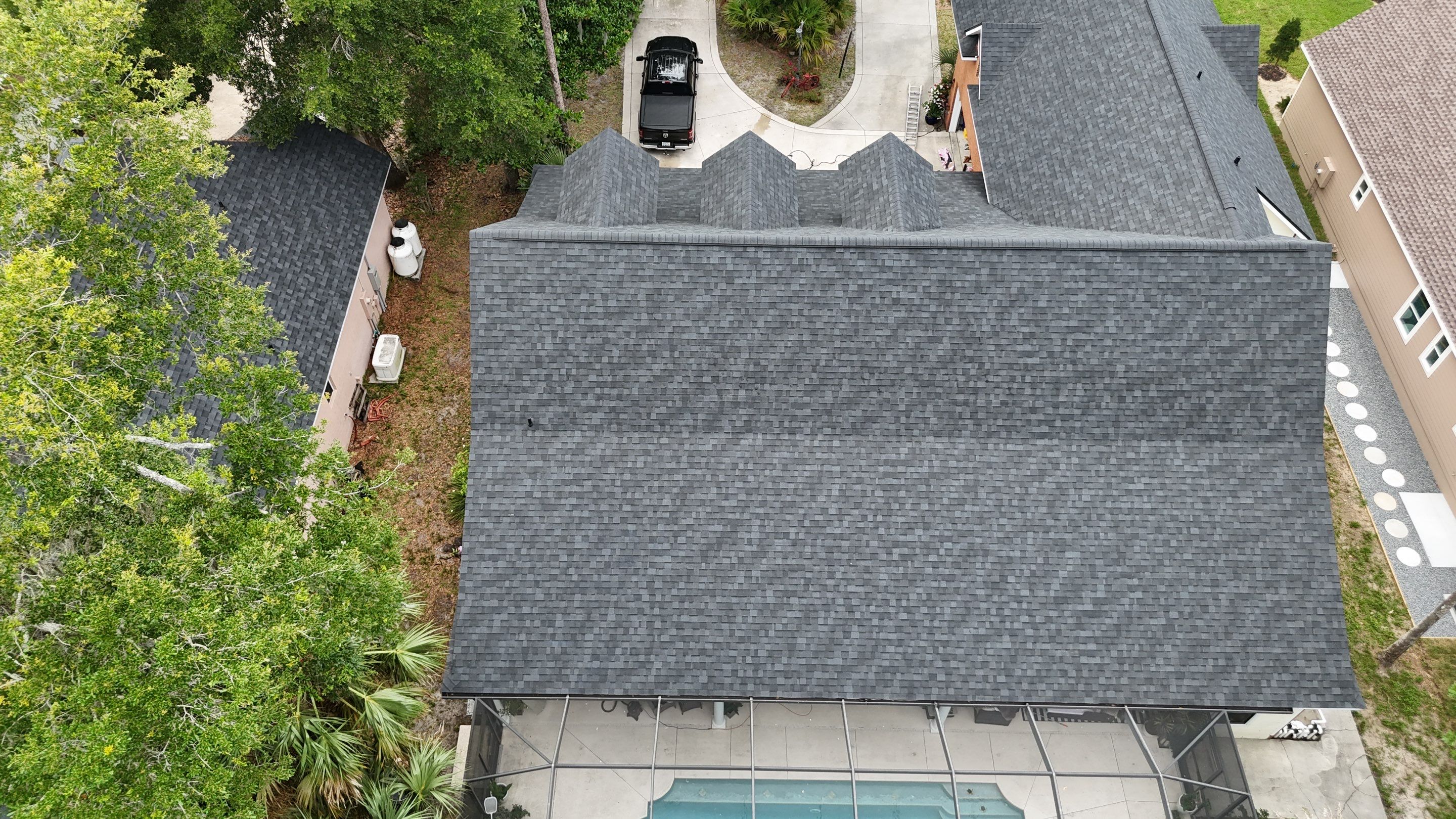 Comprehensive Onyx Black Asphalt Shingle Roof Replacement for Flagler Beach Residence by Trinity Restoration and Roofing LLC