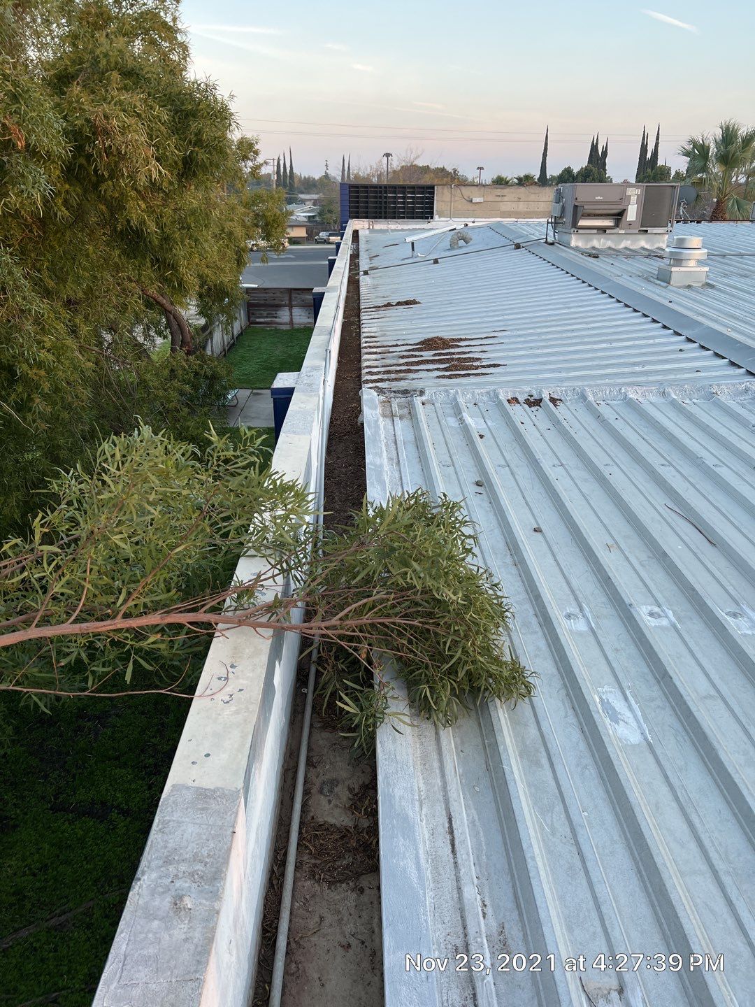Metal roof restoration on commercial roof using Conklin Benchmark/ PUMA XL acrylic coatings over metal and foam by Straight Edge Roofing Inc