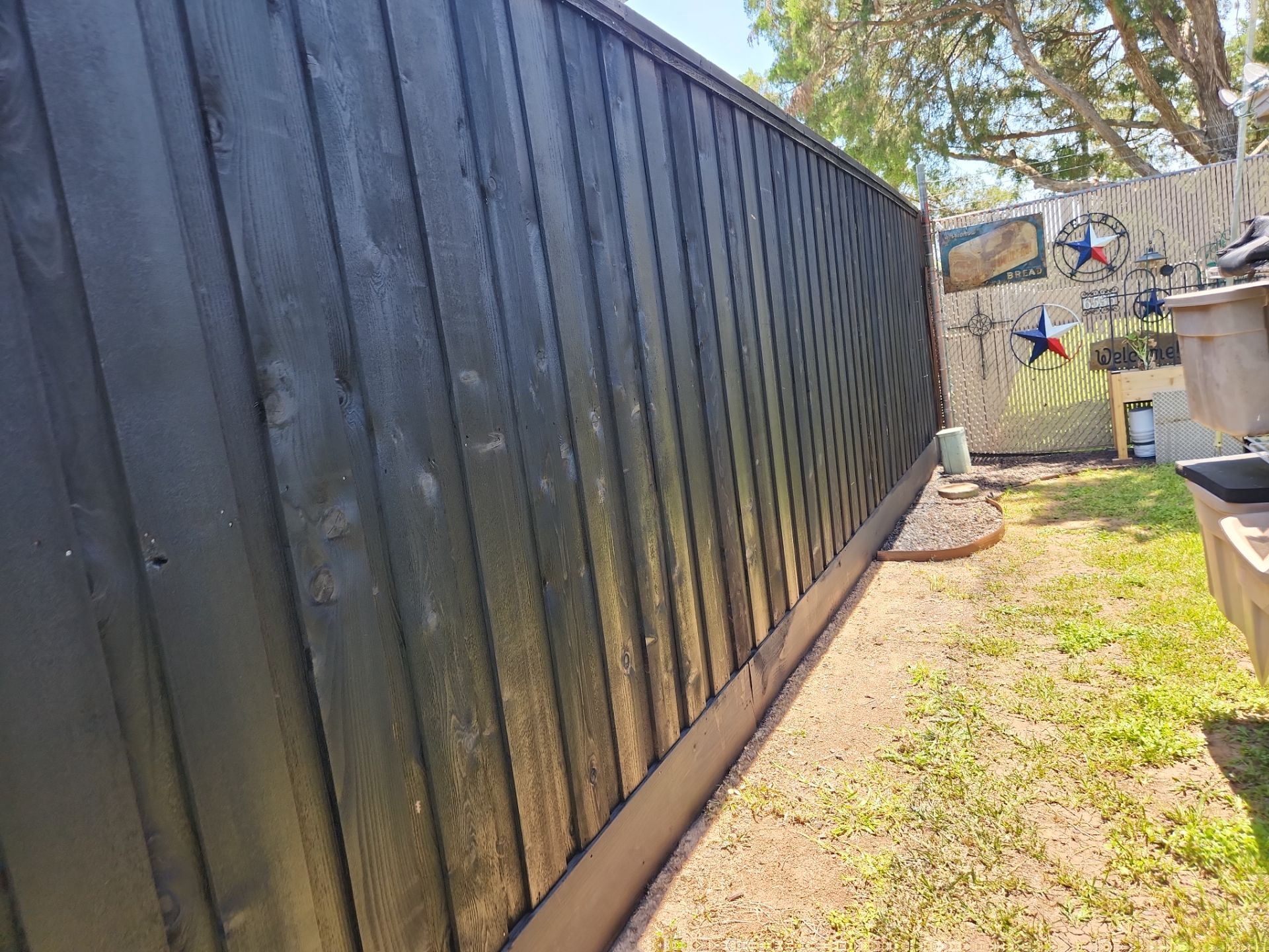 Modern Black Fence Finish by Tim's Fences