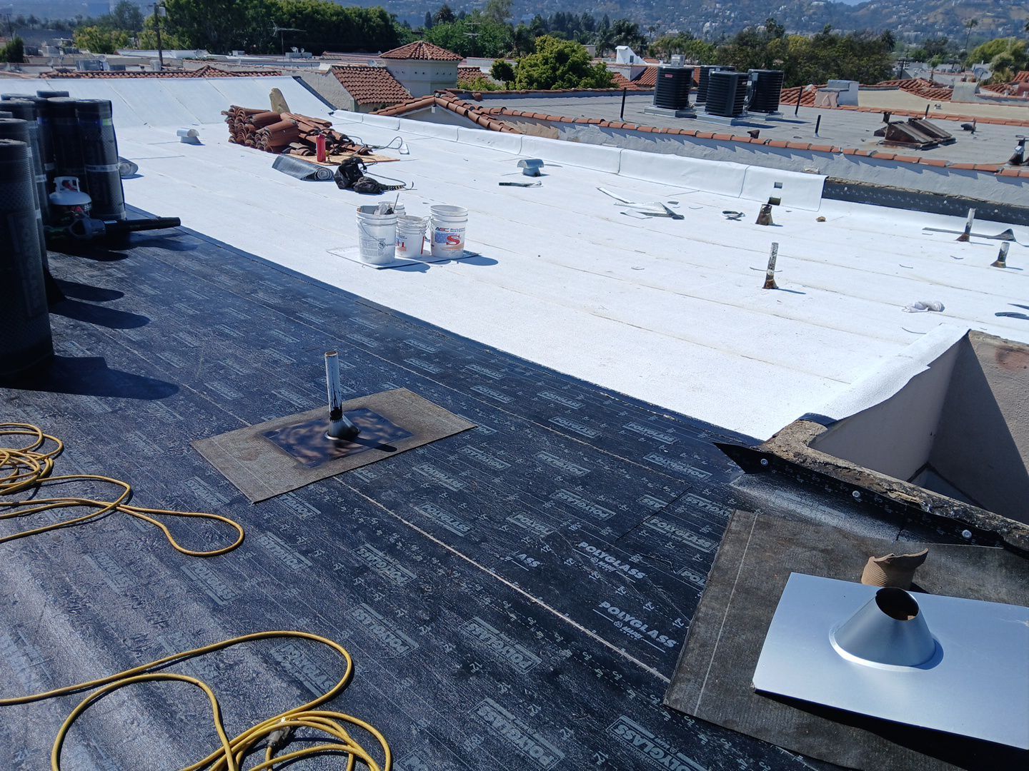 Apartment Building Reroofing using Polyfresko® G Highly Reflective Modified Bitumen Cap Sheet by Hull Brothers Roofing