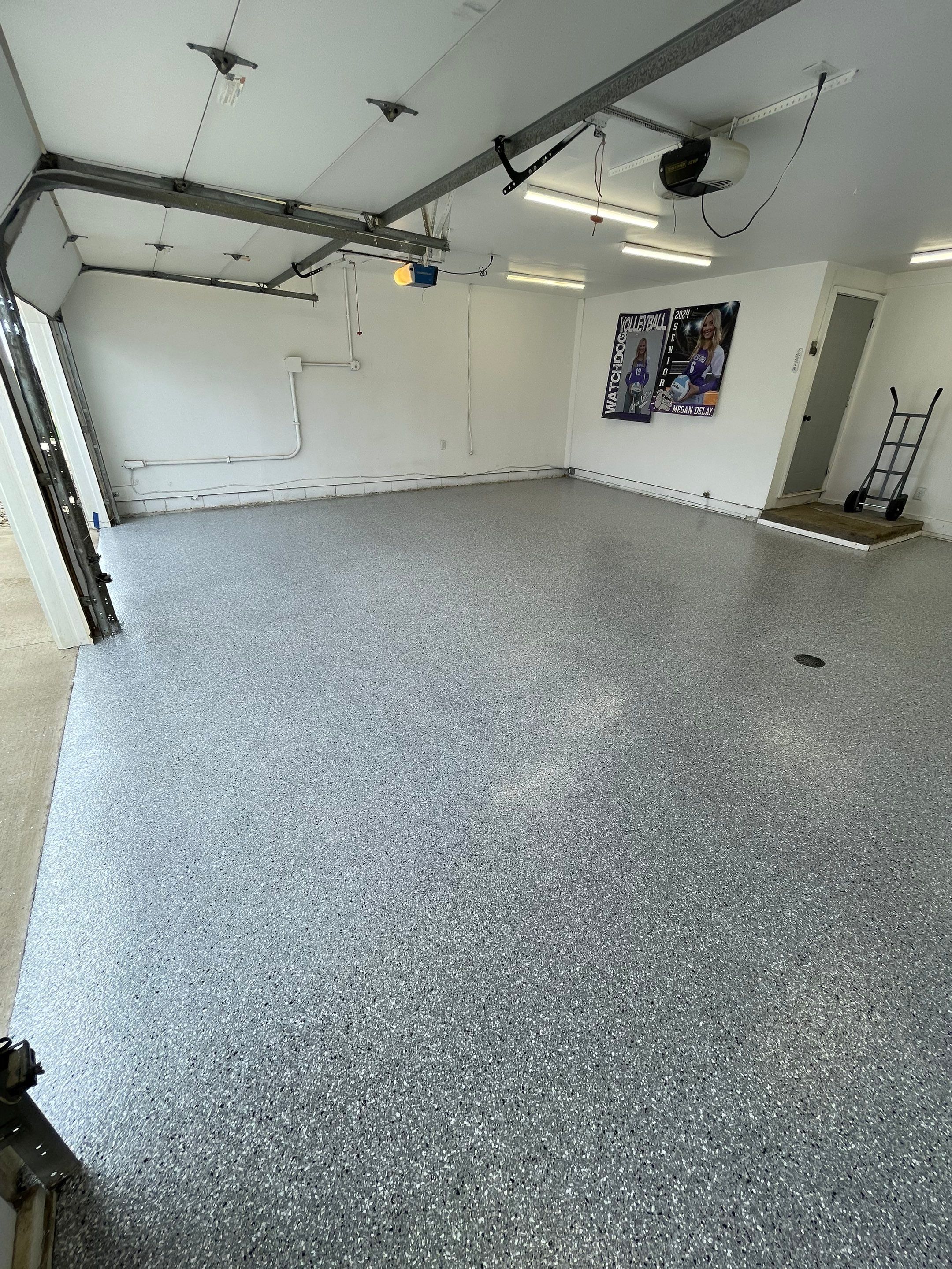 Feather Grey Garage Floor Coating and Crack Repair in Beresford by Select Painting, Coatings & Garage Cabinets