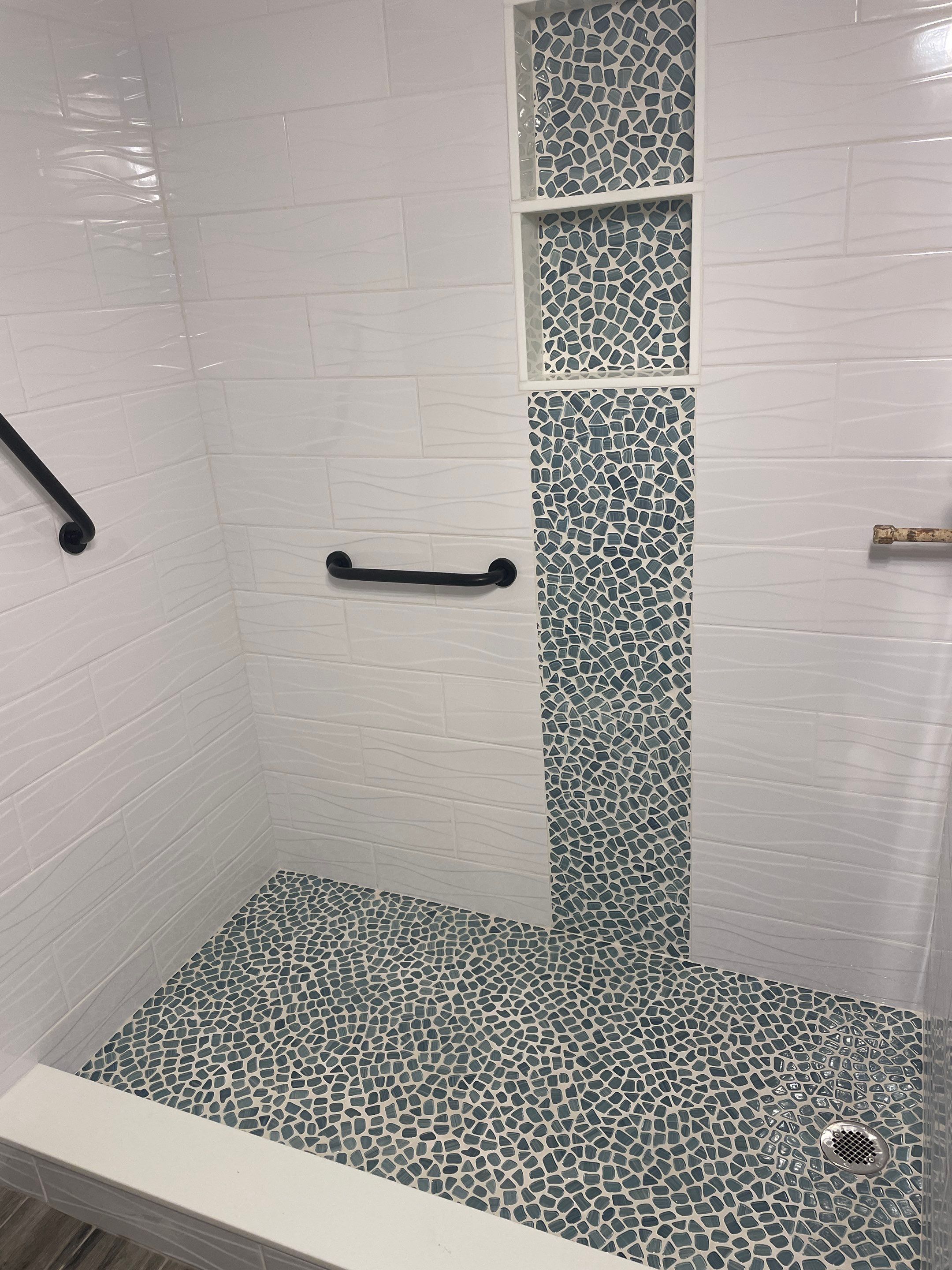 Sleek bathroom shower remodel by Footprints Floors of East Atlanta