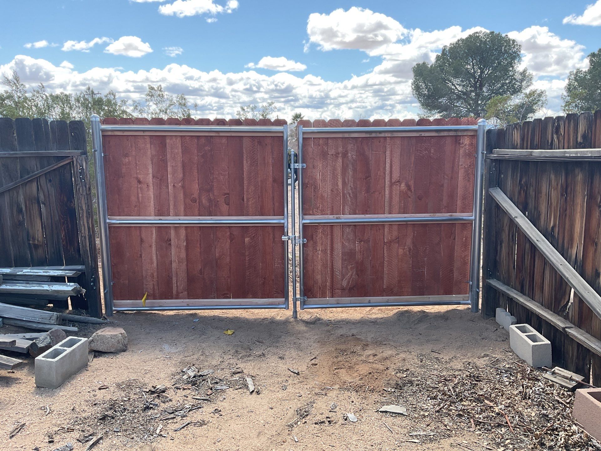 Gate installation using Wood by Fence Guys Inc. 