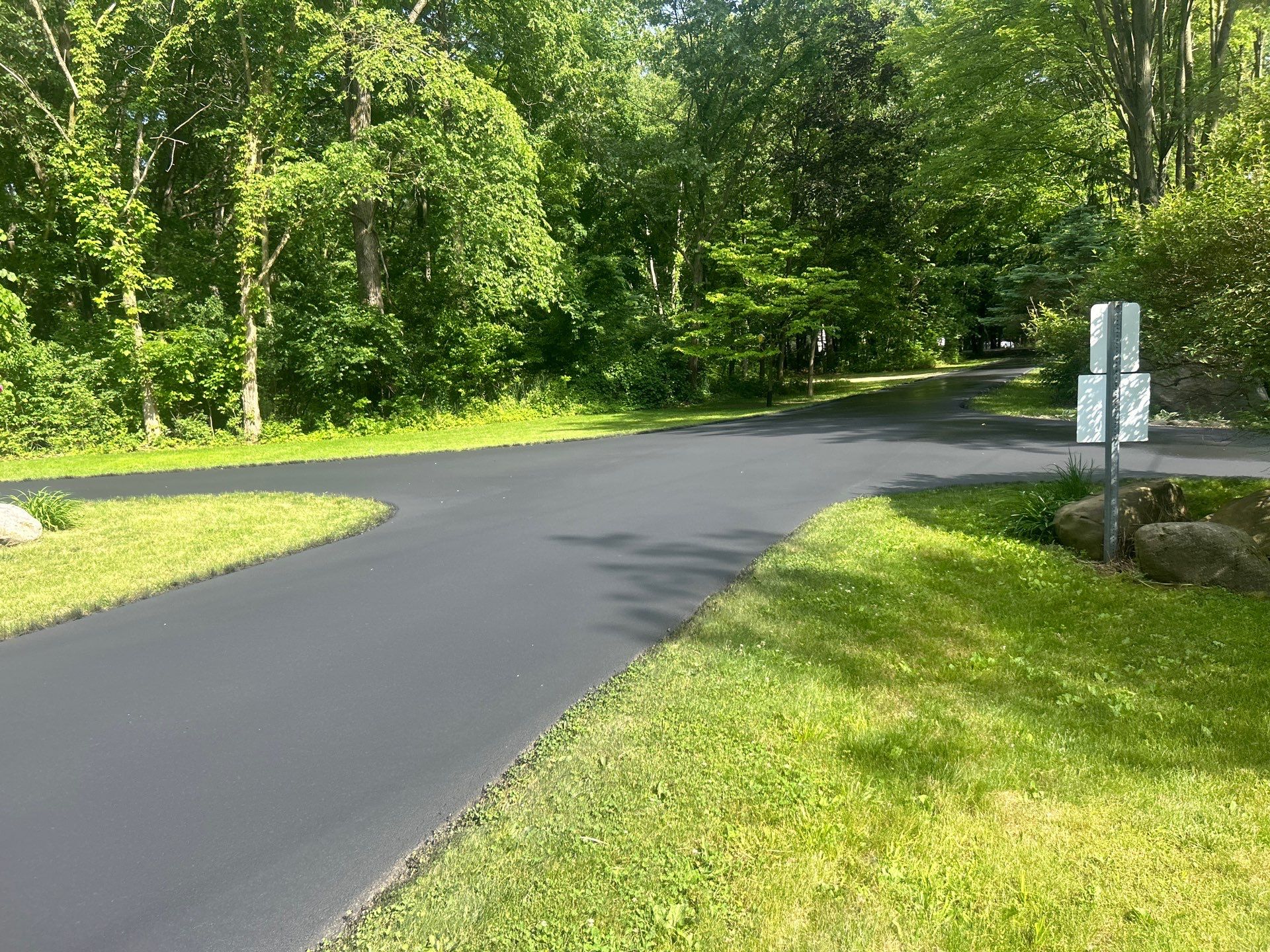 High end residential driveway by Quality Asphalt & Maintenance LLC
