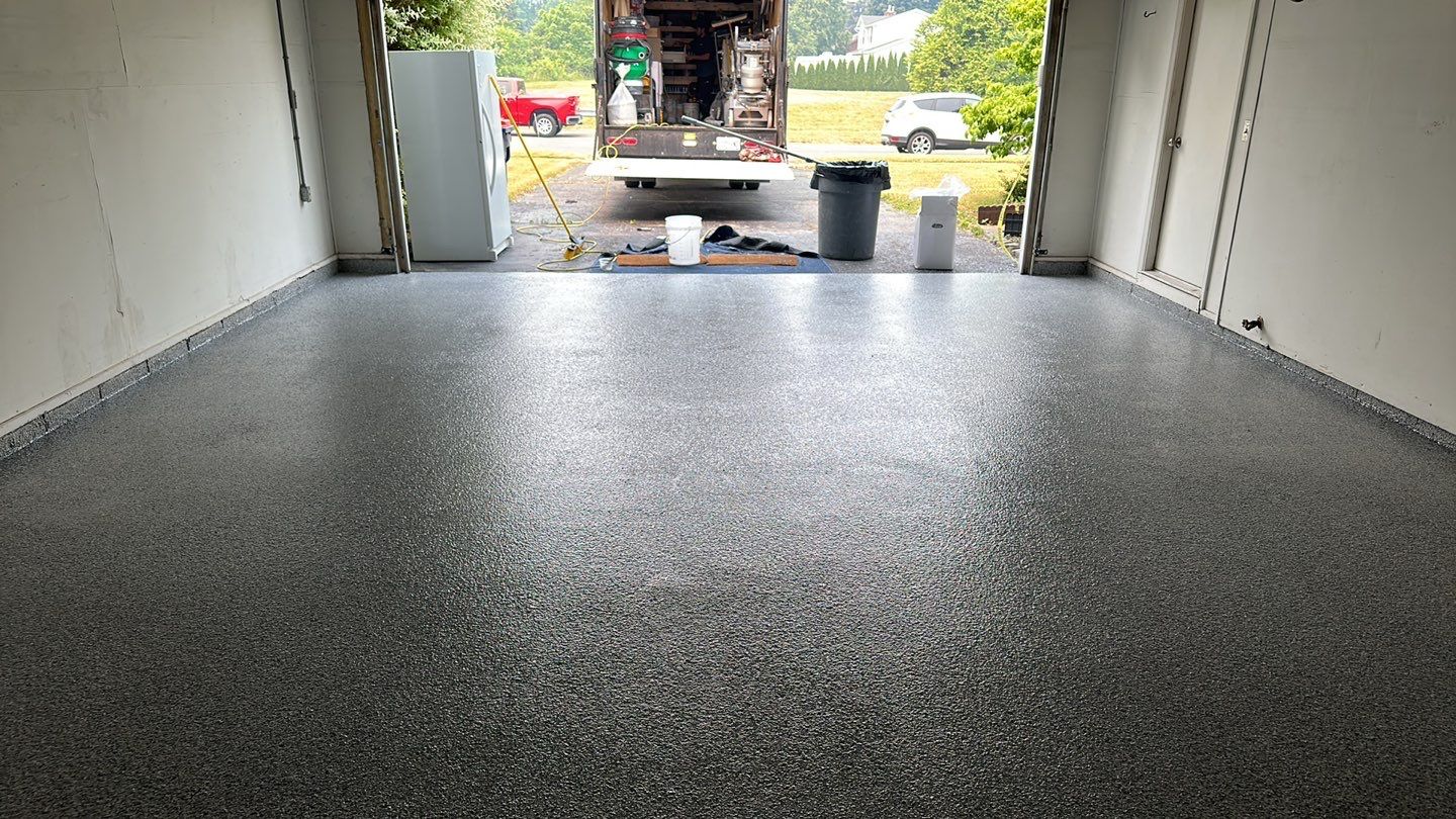 Silverado garage floor coating  by NG Masonry & Construction LLC
