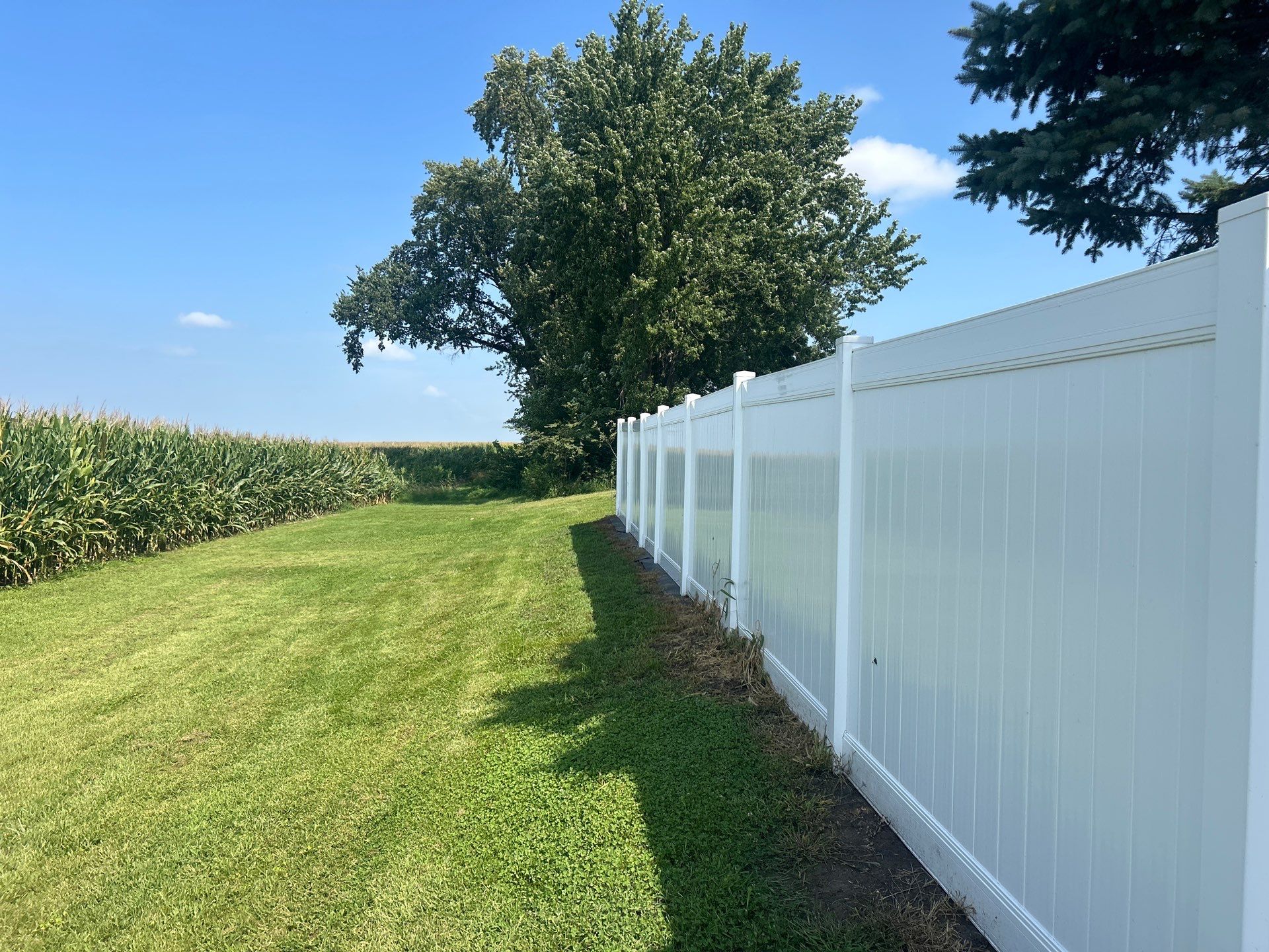 White Vinyl Privacy Fence Installation in Waterloo Iowa by Perfect Picket Fence and Stain