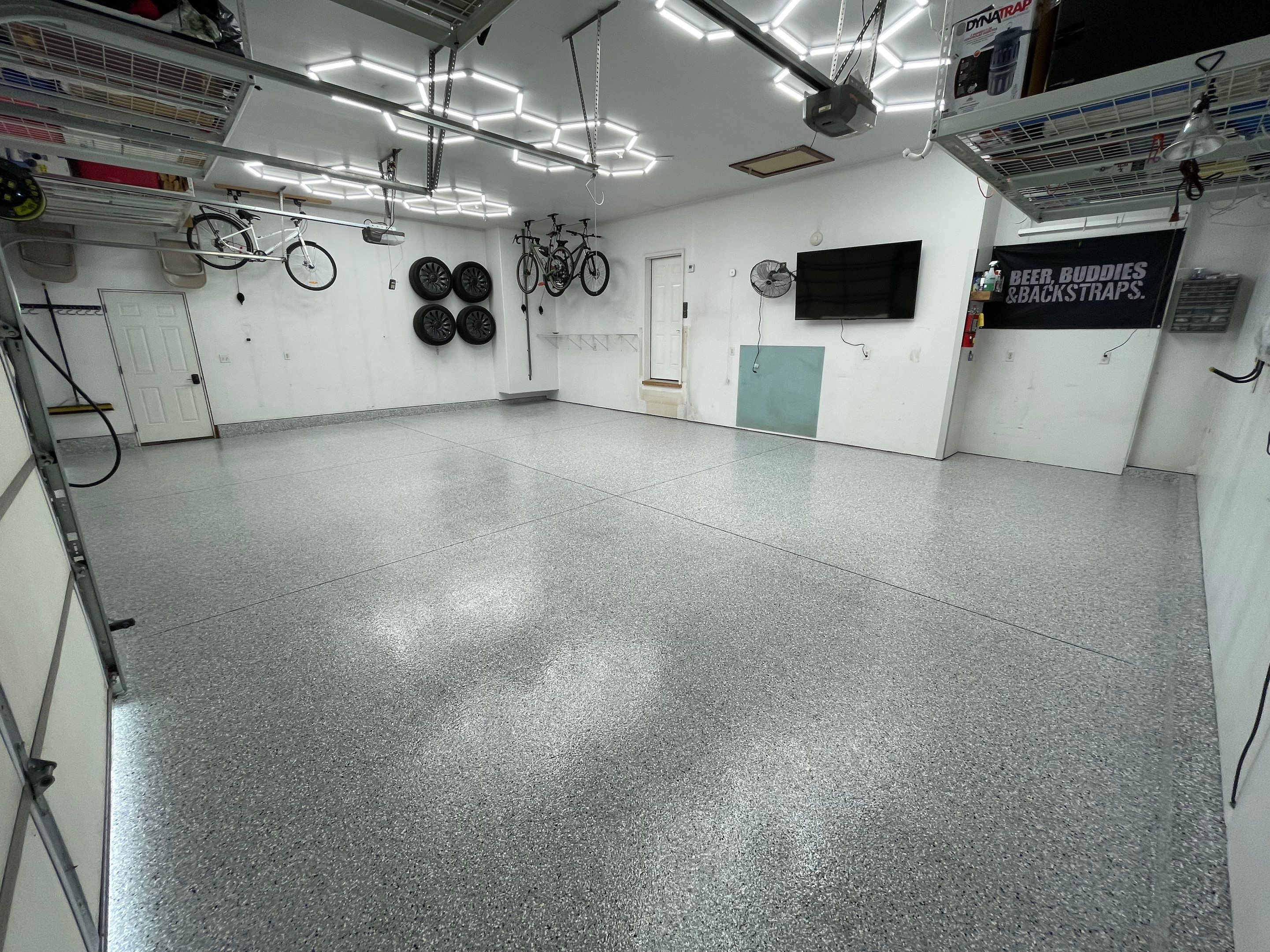 Feather Gray Epoxy Floor Coating Installation in Sioux Falls by Select Painting, Coatings & Garage Cabinets