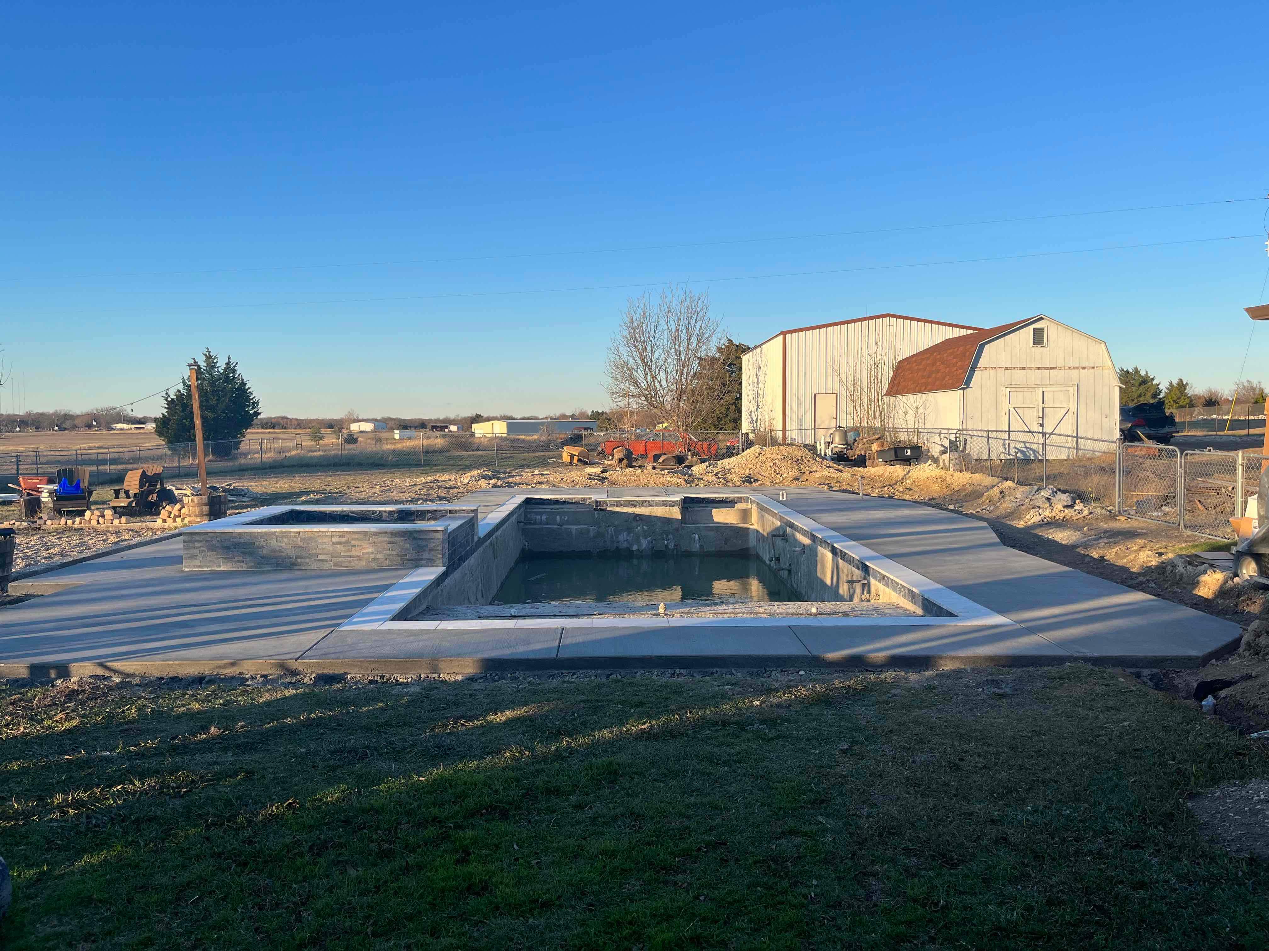 Geometric Pool with Beach Entry, Slide and Raised Spa by Pinnacle Pools and Spas - DFW