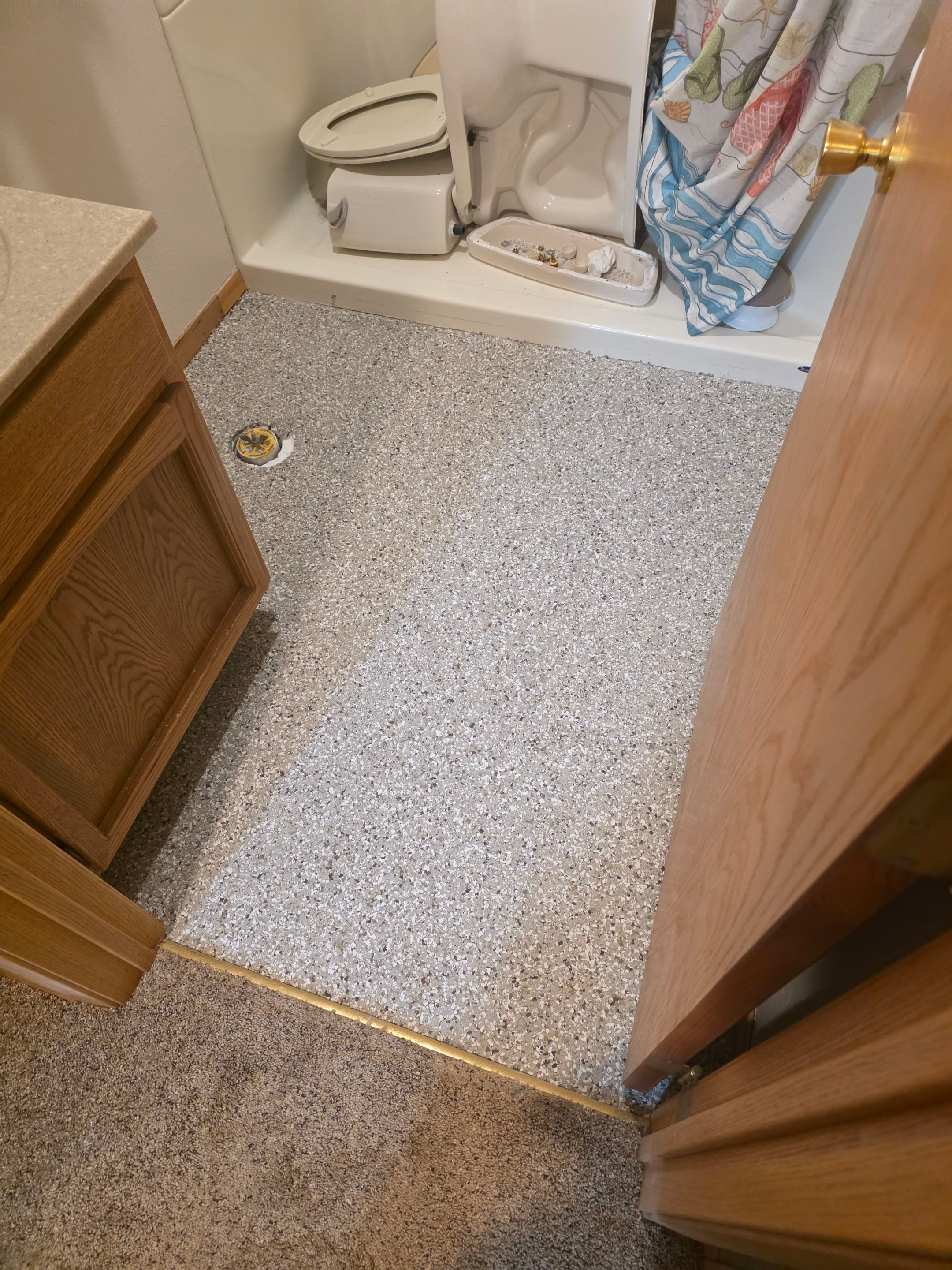 Full Garage and Basement Epoxy Floor Coating in Winner by Select Painting, Coatings & Garage Cabinets