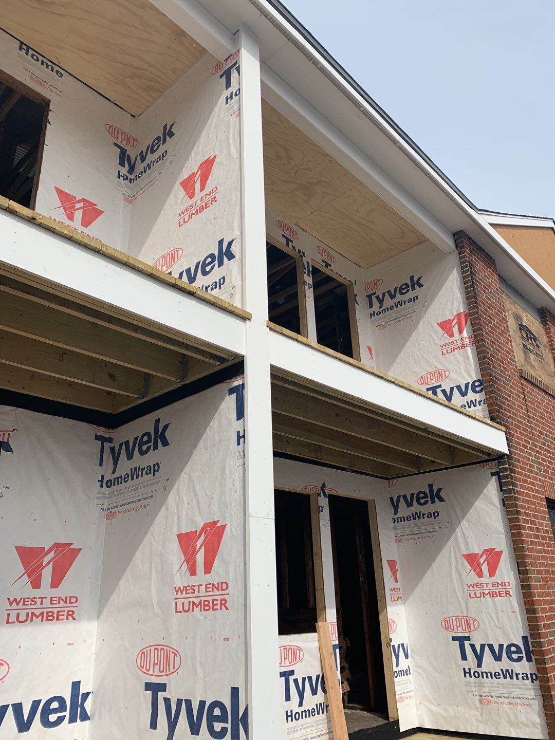 Commercial Roofing Installation using EPDM with white gutters by A Plus Exterior