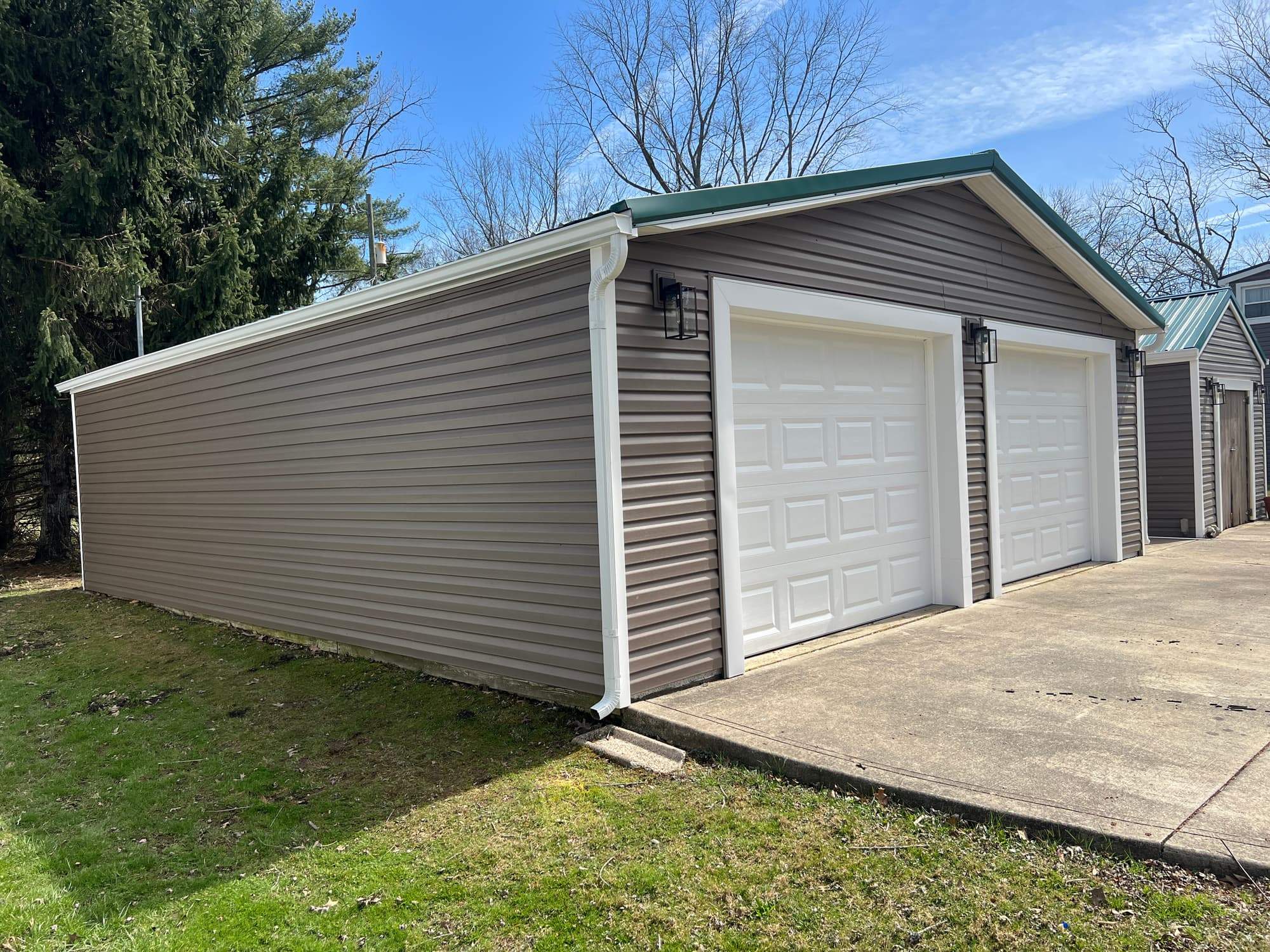 Green Metal Roof Installation and Exterior Renovation in Thornville by Canopy Contracting
