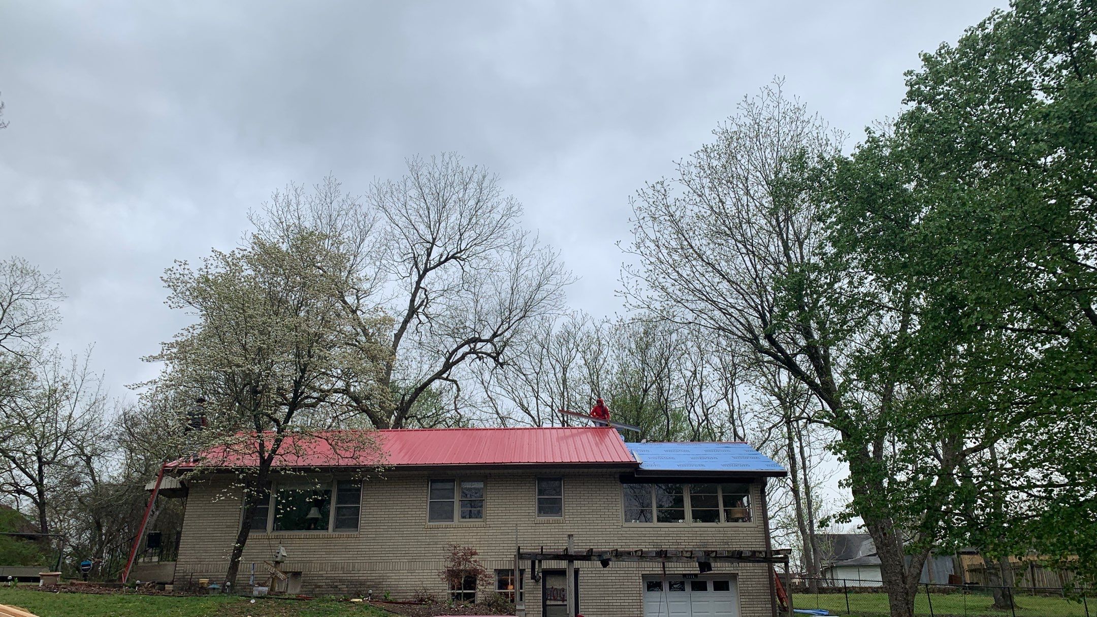 Residential Roofing Installation using 26 Gauge Colored Panels by Hostetler Roofing