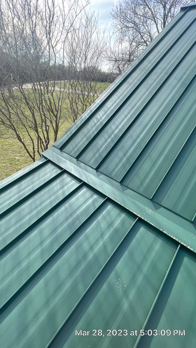 Shingle to Standing Seam Metal Roof by Springtree Restoration
