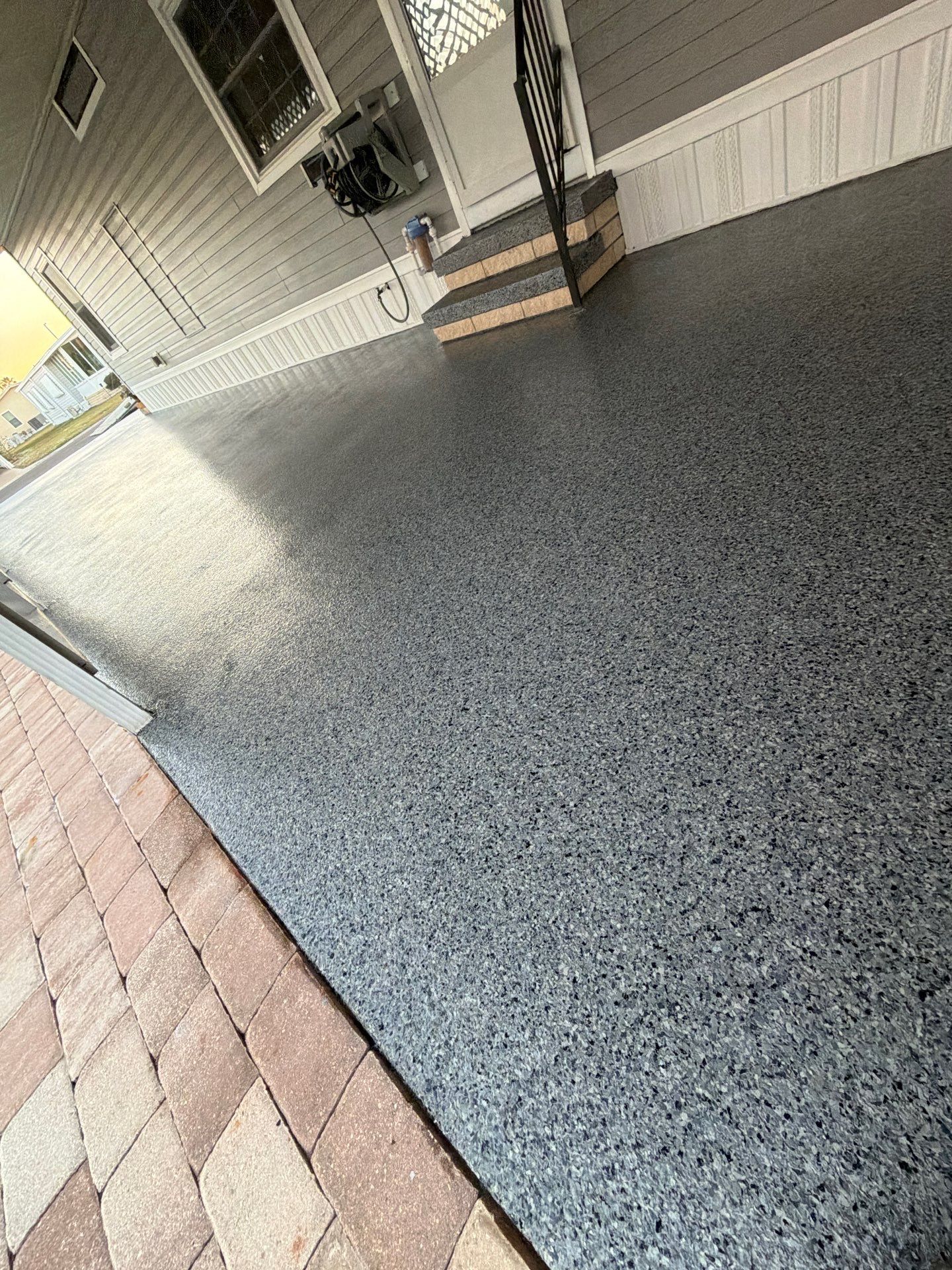 Driveway Transformation: Nightfall Flake System with Full UV & Moisture Protection by Performance Floors & Coating