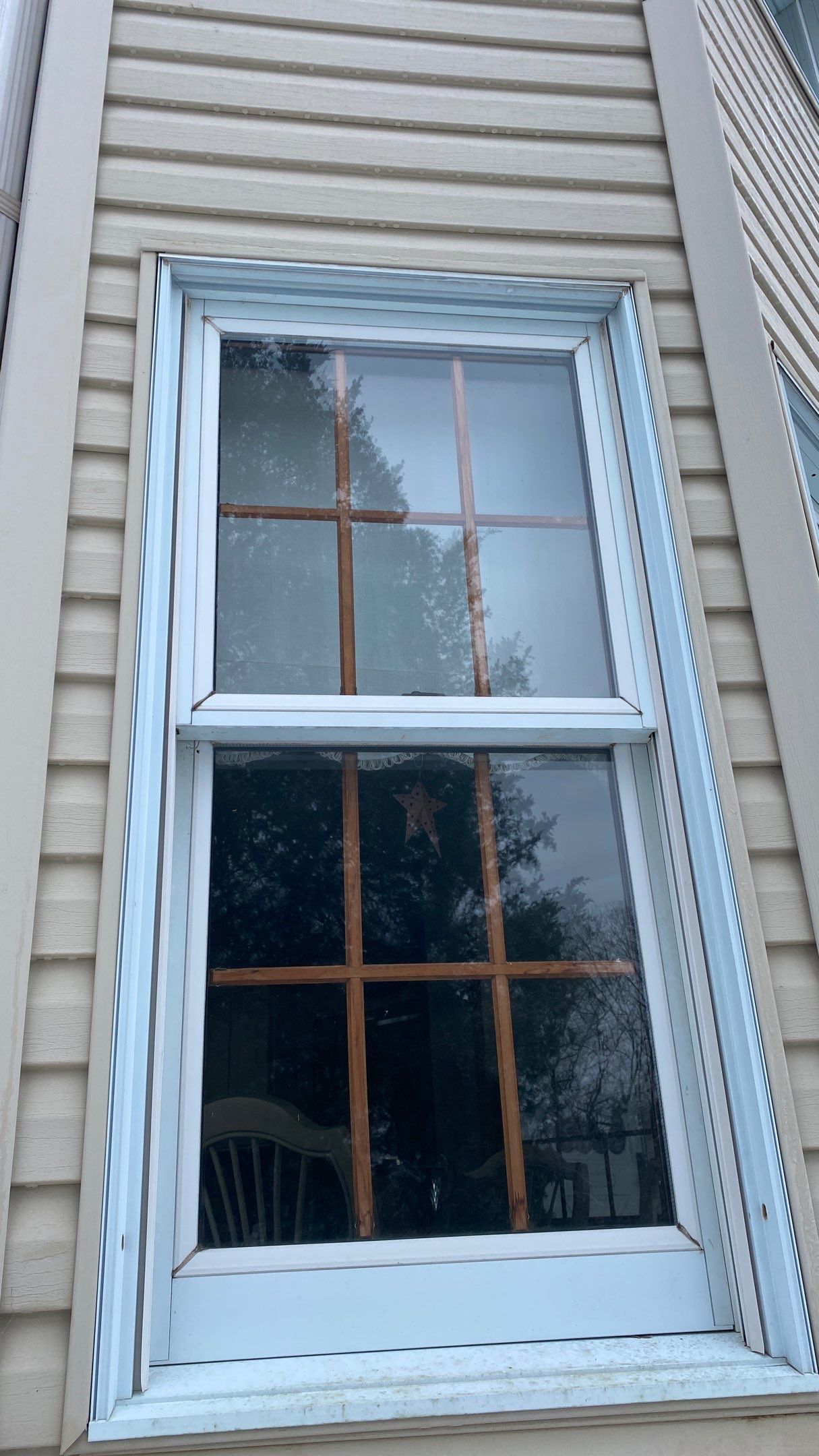 Exterior remodel including window replacement by American Home Contractors
