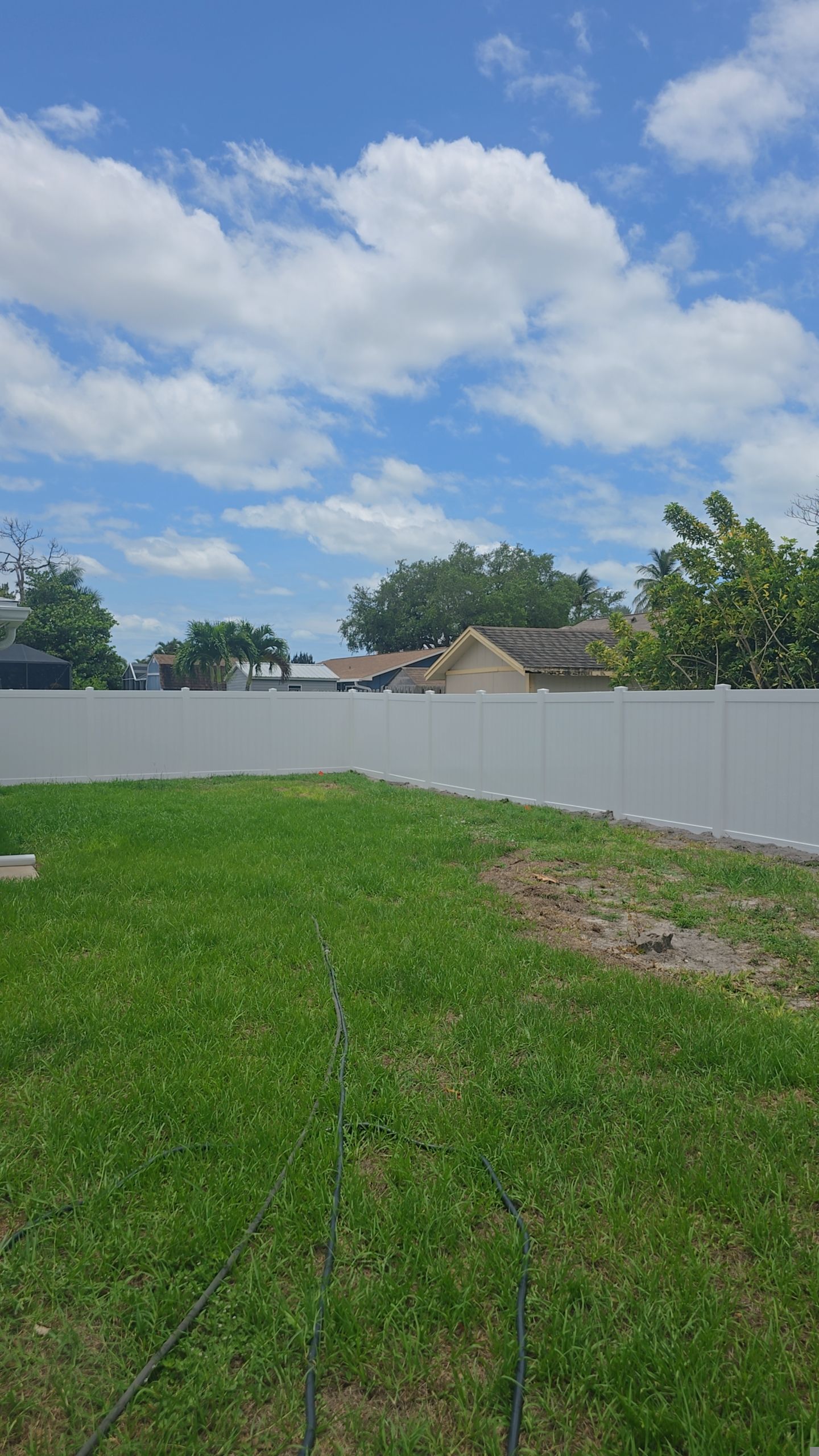 White Vinyl Privacy Fence Installation in Bonita Springs by True Fence LLC