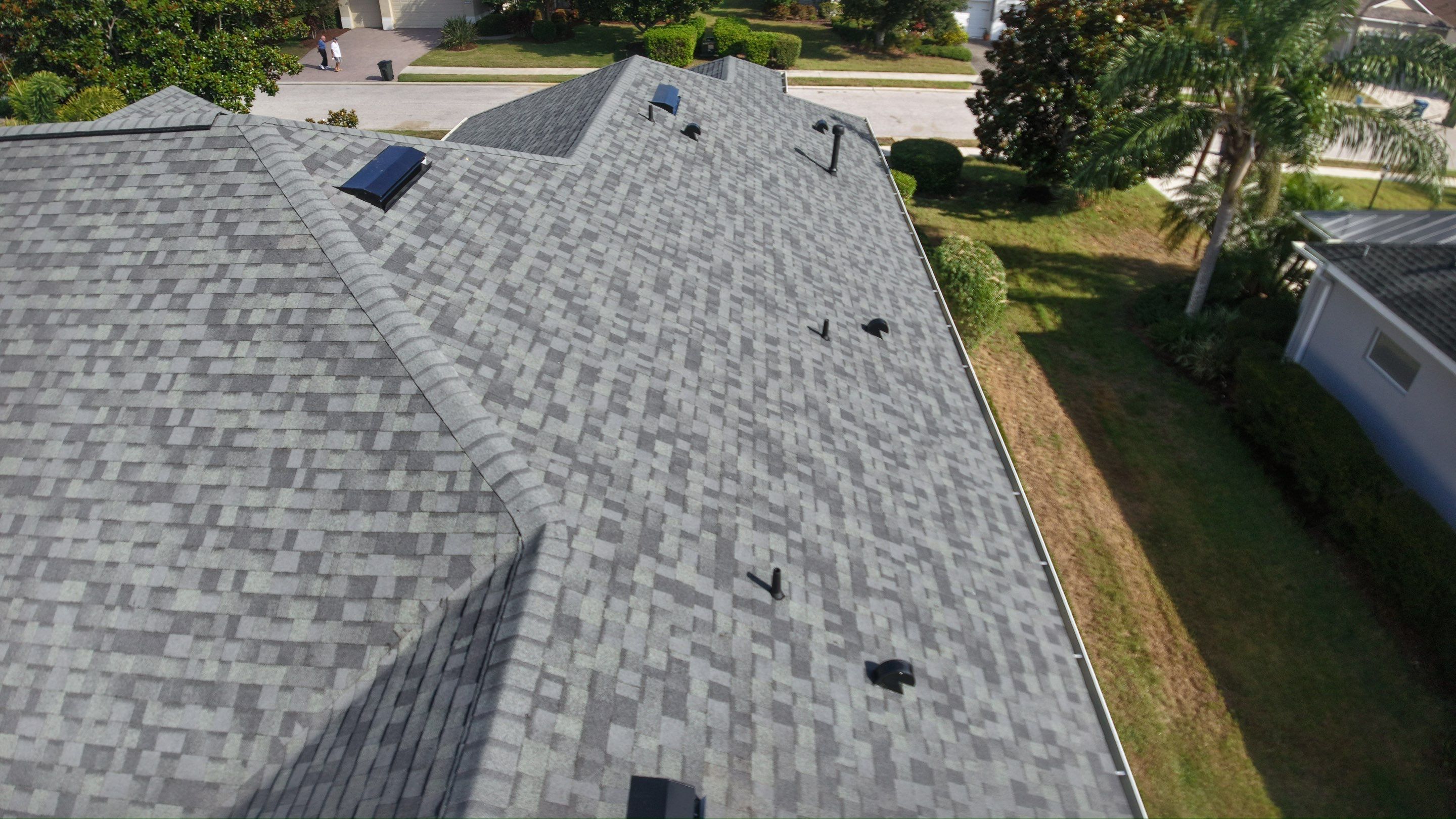 Residential Roof Installation With Estate Grey Architectural Shingles in Bradenton by Trinity Restoration and Roofing LLC