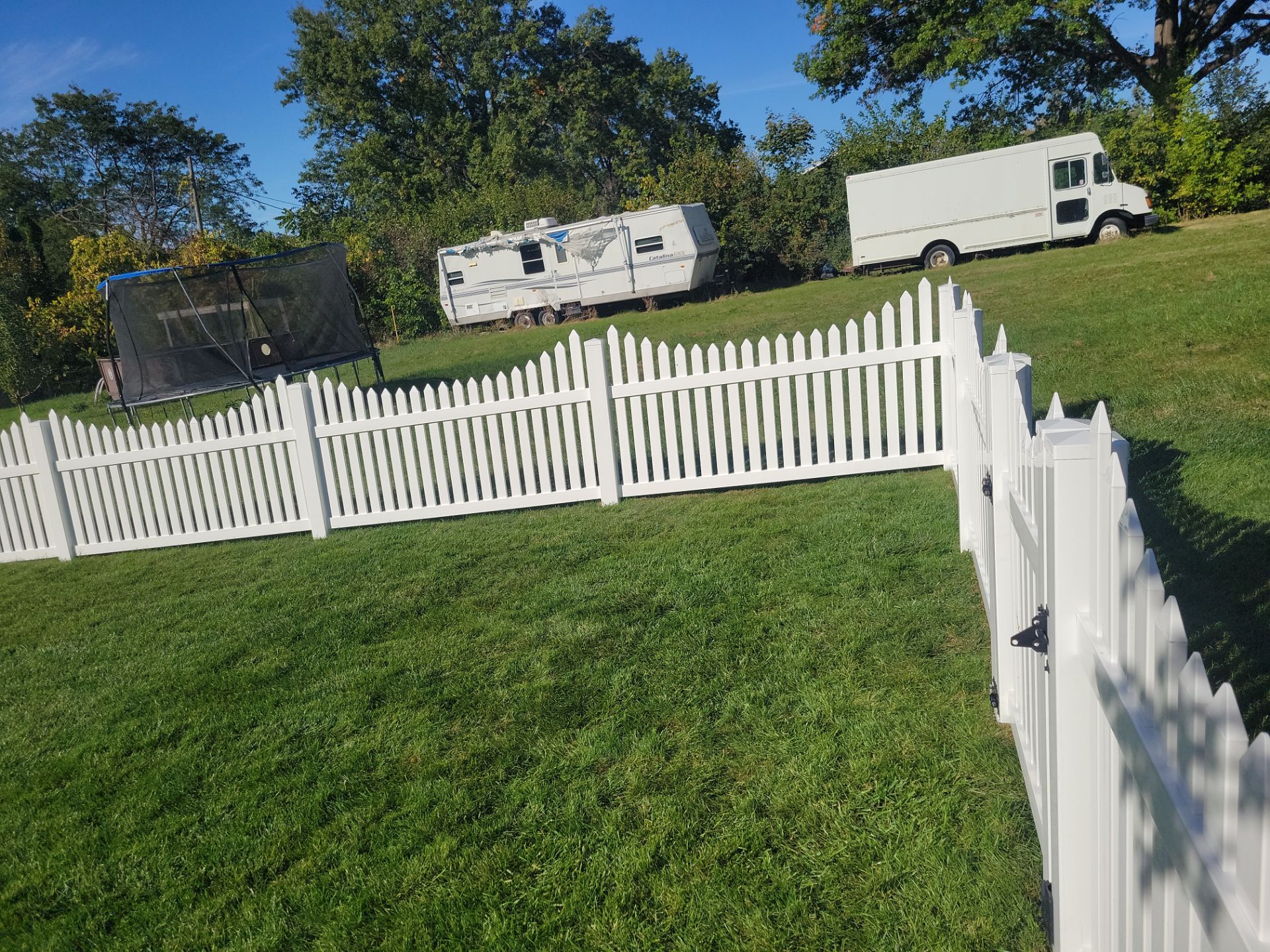 White Vinyl Spaced Picket Fence Installation in Waterloo by Perfect Picket Fence and Stain