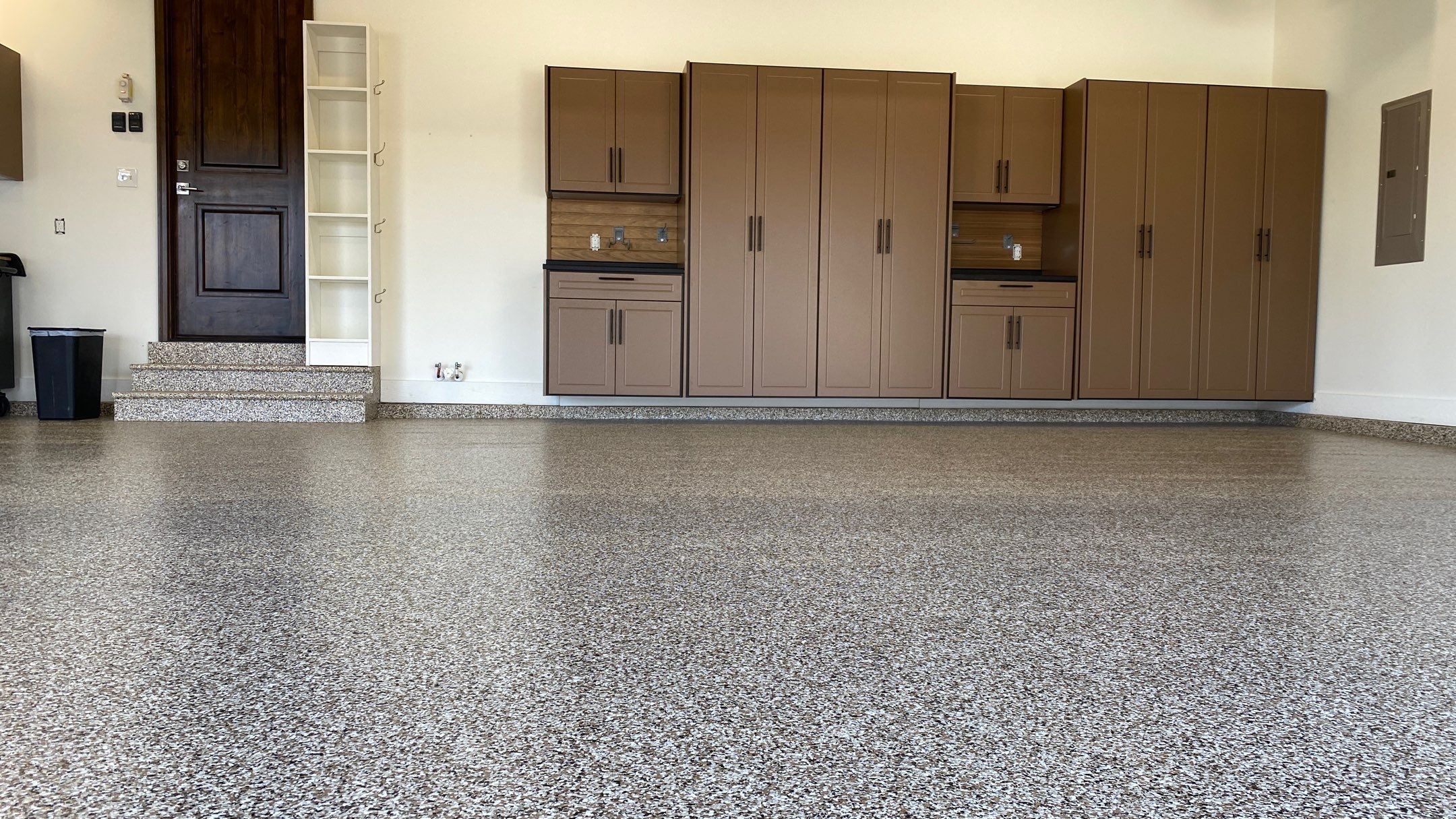 Kenny & Debbie transformed their garage with a Banner Garage Floor and cabinets by Banner Garage