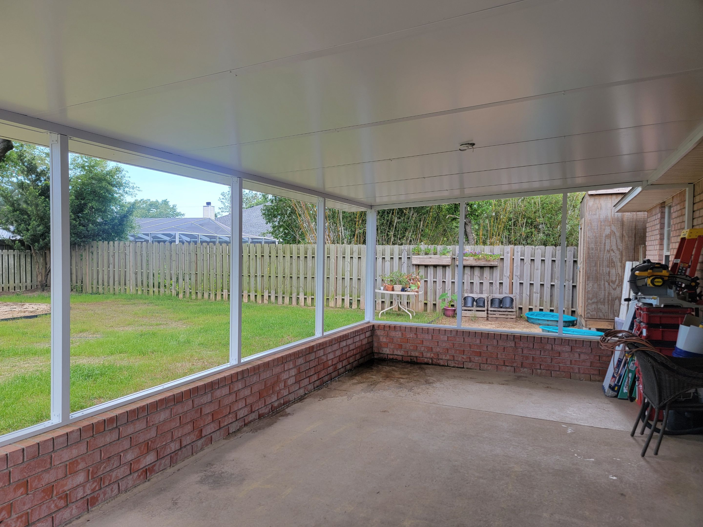 Screen Room in Milton w/Brick Kneewall by Titan Sunrooms