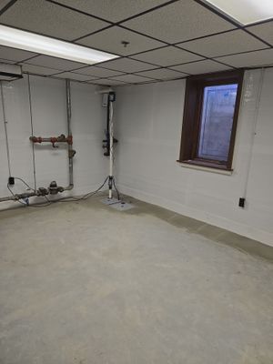 Interior Basement Waterproofing System with Embedded Fiber Reinforcement