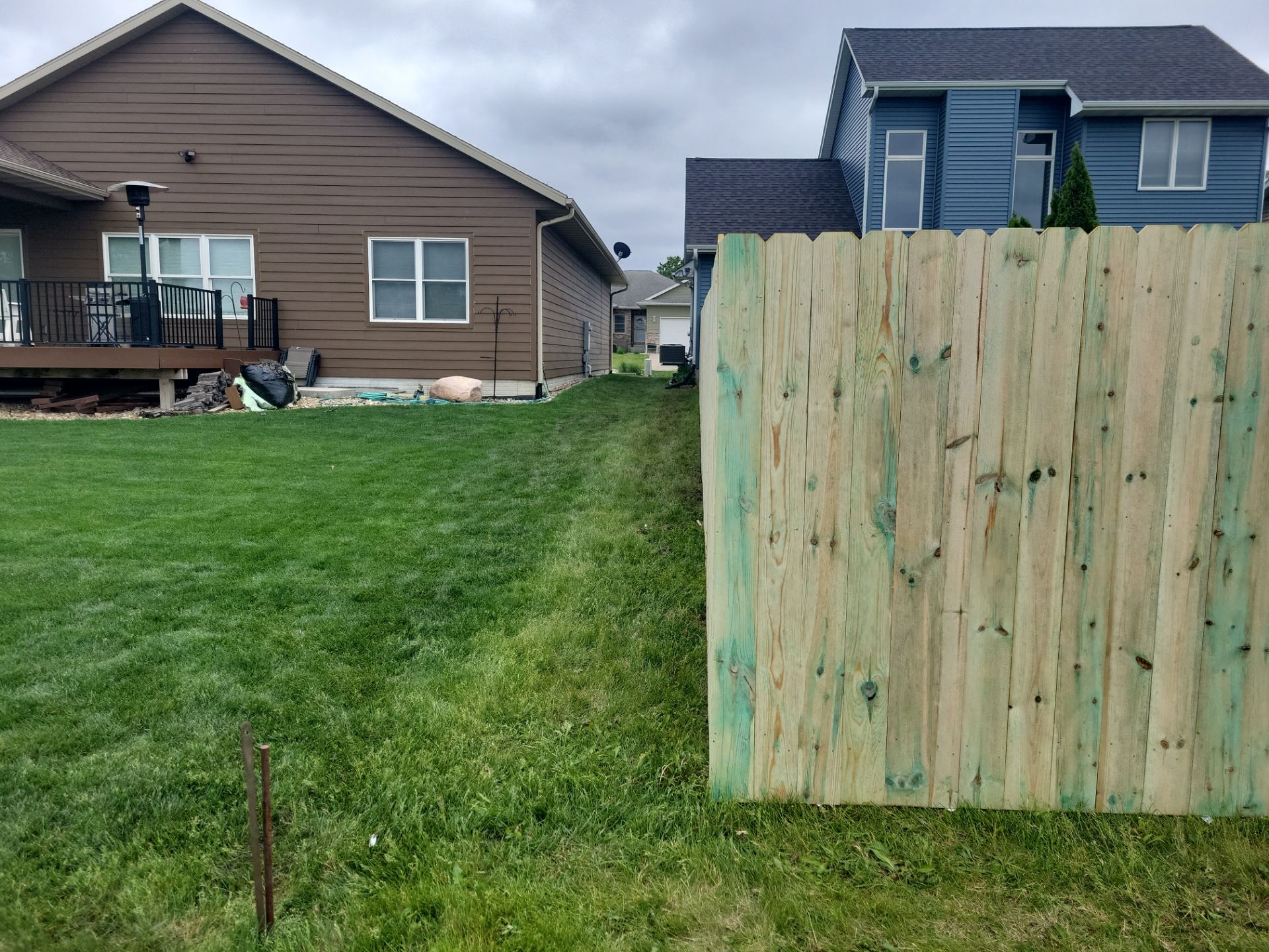 Pressure-Treated Wood Privacy Fence Installation in Waterloo by Perfect Picket Fence and Stain