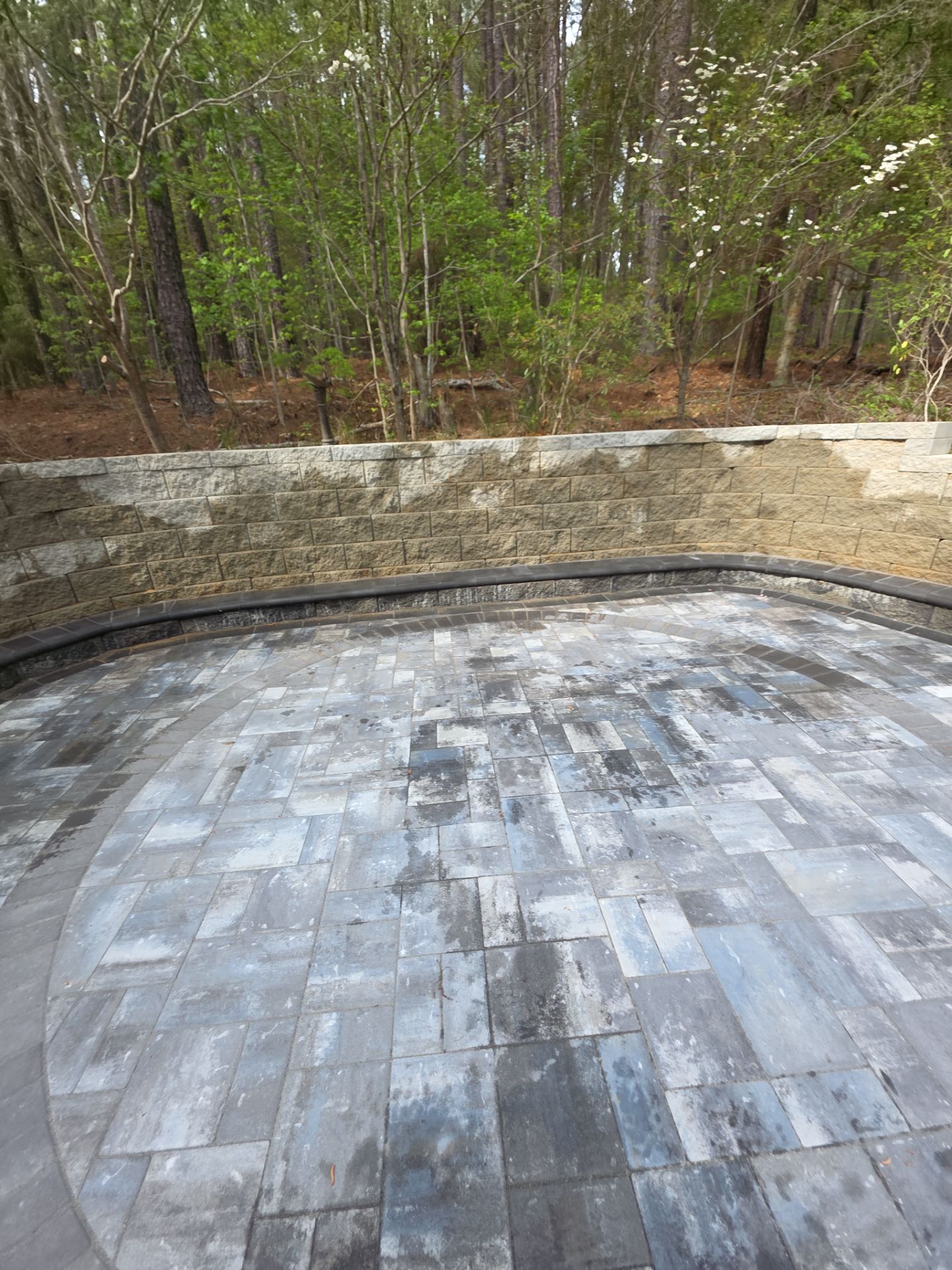 Pittsboro Outdoor Living Transformation – Retaining Wall, Paver Patio & Elevated Deck by Elite Remodeling and Design LLC