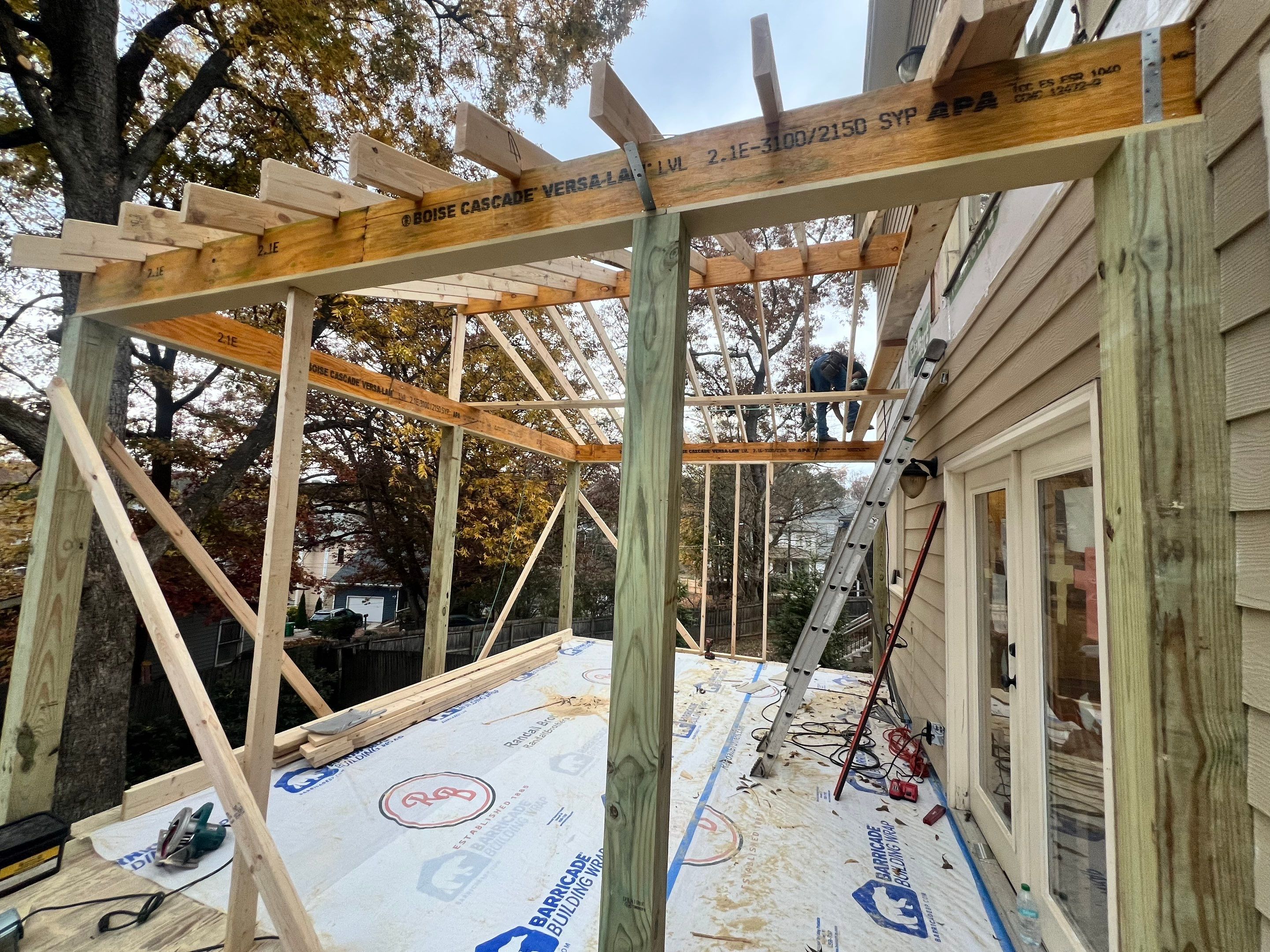Screened-In Porch With Fireplace by Swift Home Renovations 