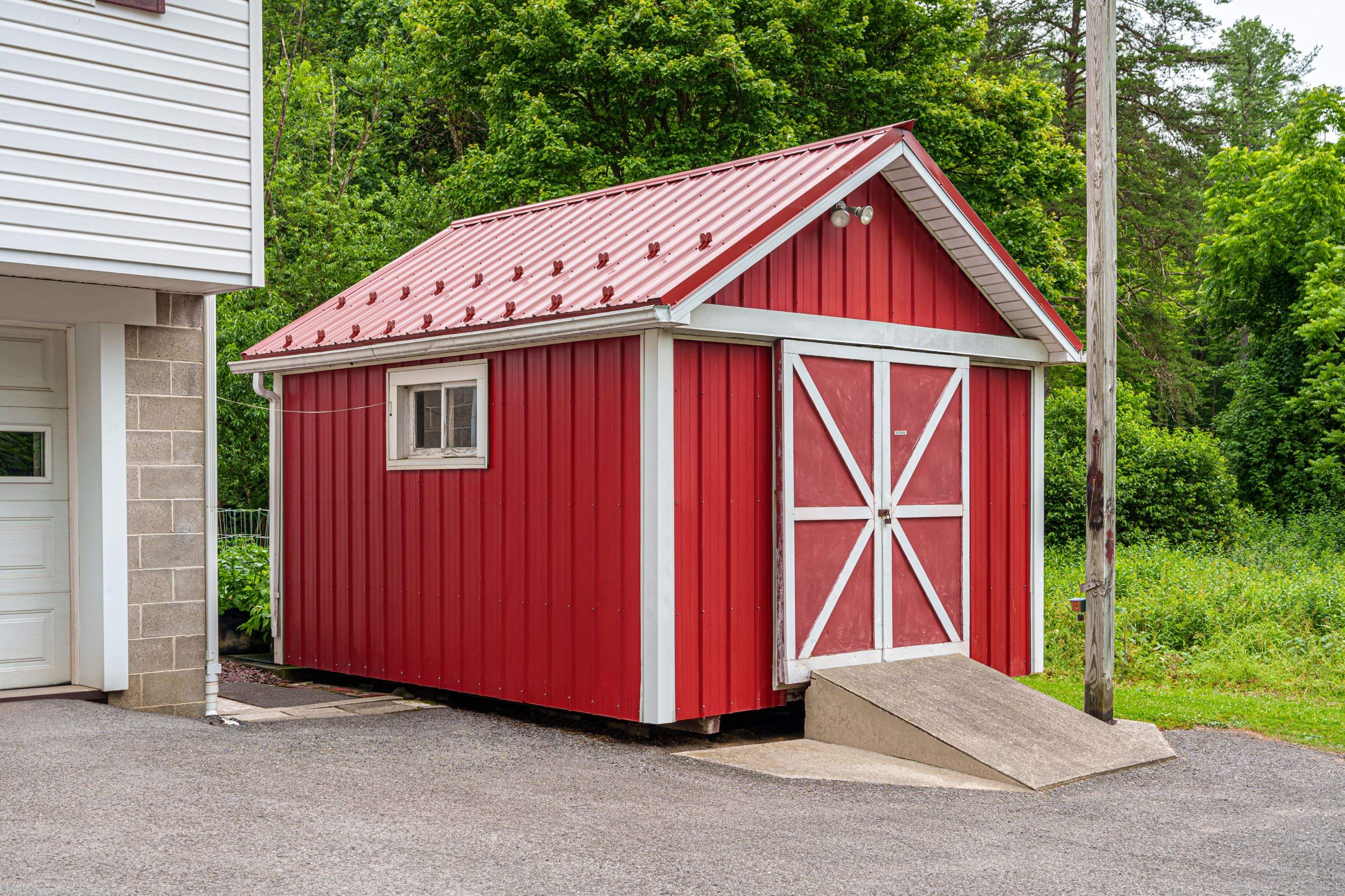 Metal roof -barn red, and New garage by Esh Builders